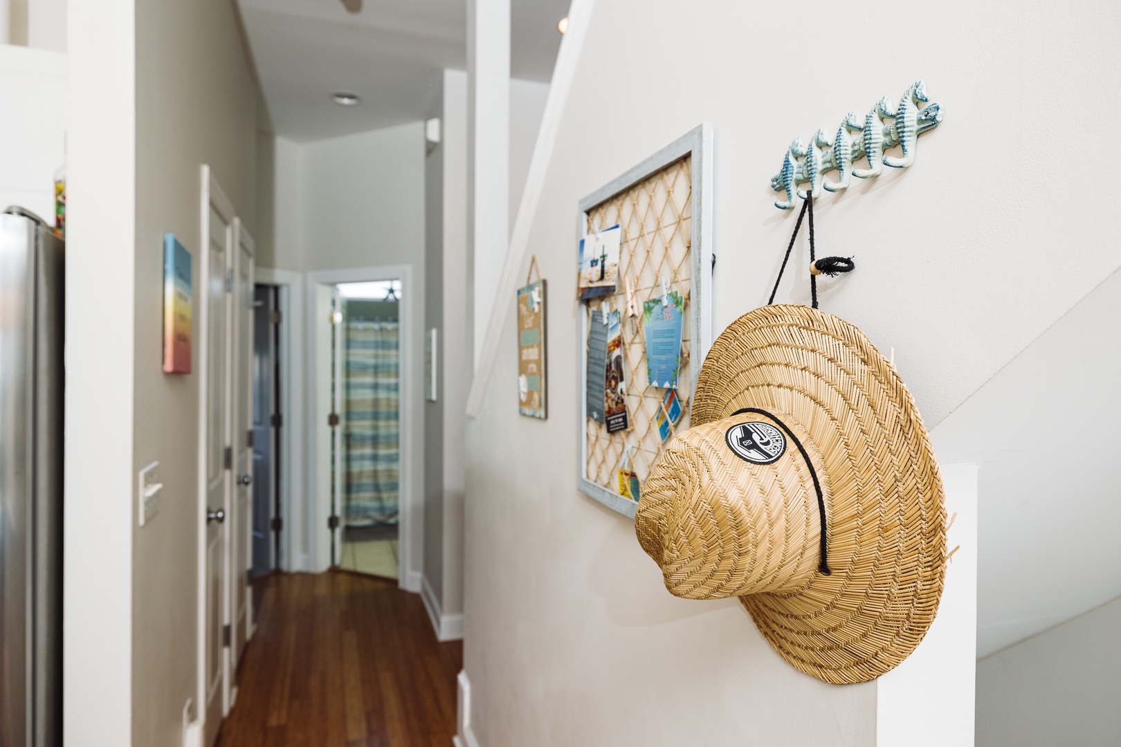 Your beach-themed hallway welcomes you with coastal charm—grab your hat from the convenient hooks and explore your seaside retreat.