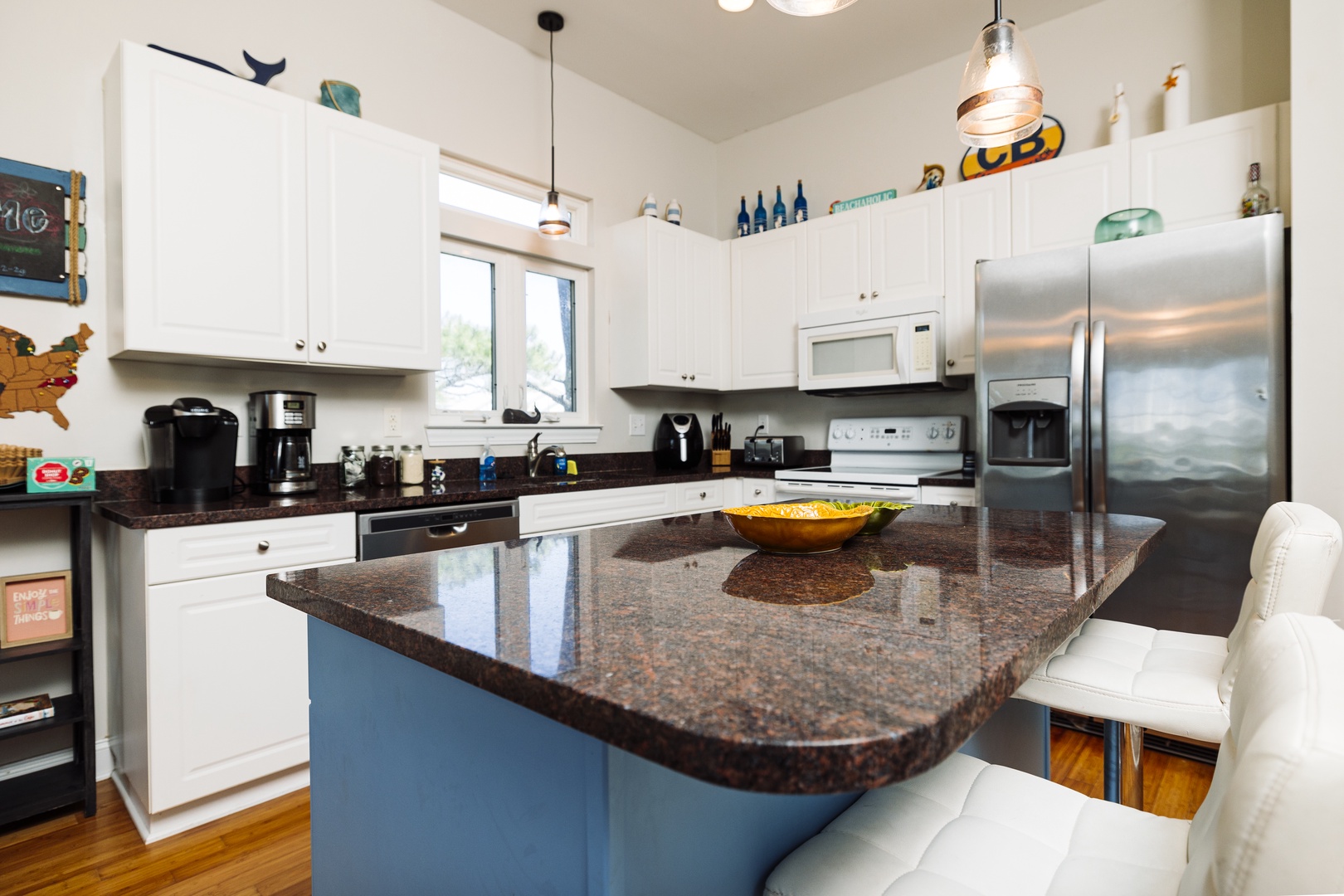 Your spacious kitchen awaits with gleaming granite countertops, modern appliances, and a breakfast bar where you can sip morning coffee.
