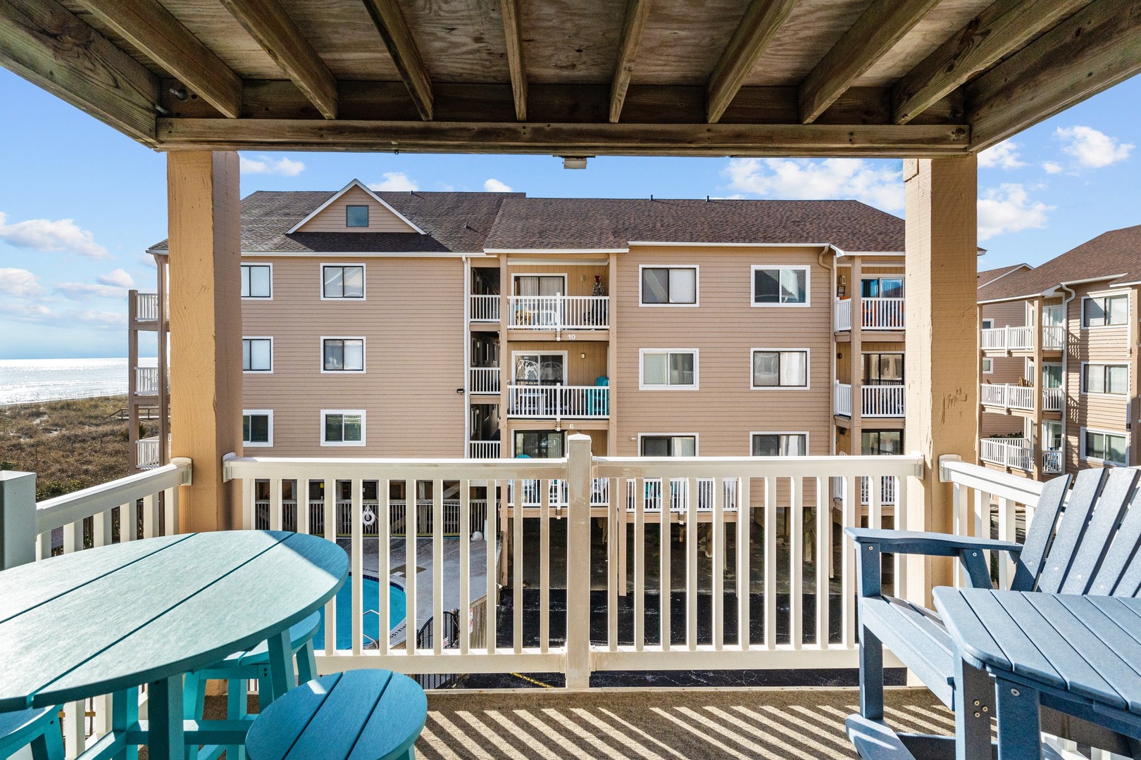 Relax on your private covered balcony with coastal breezes and colorful seating perfect for morning coffee or sunset cocktails.