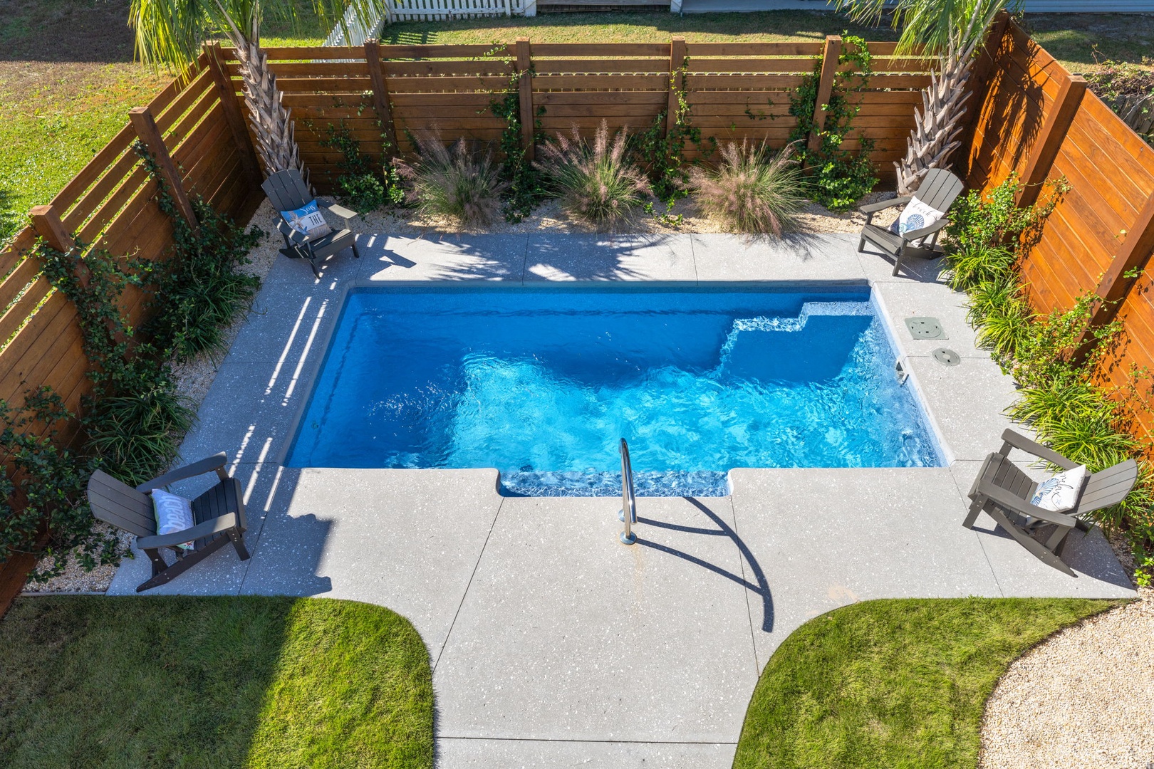 Your private oasis awaits with crystal-clear waters and comfortable loungers for sun-soaked relaxation.