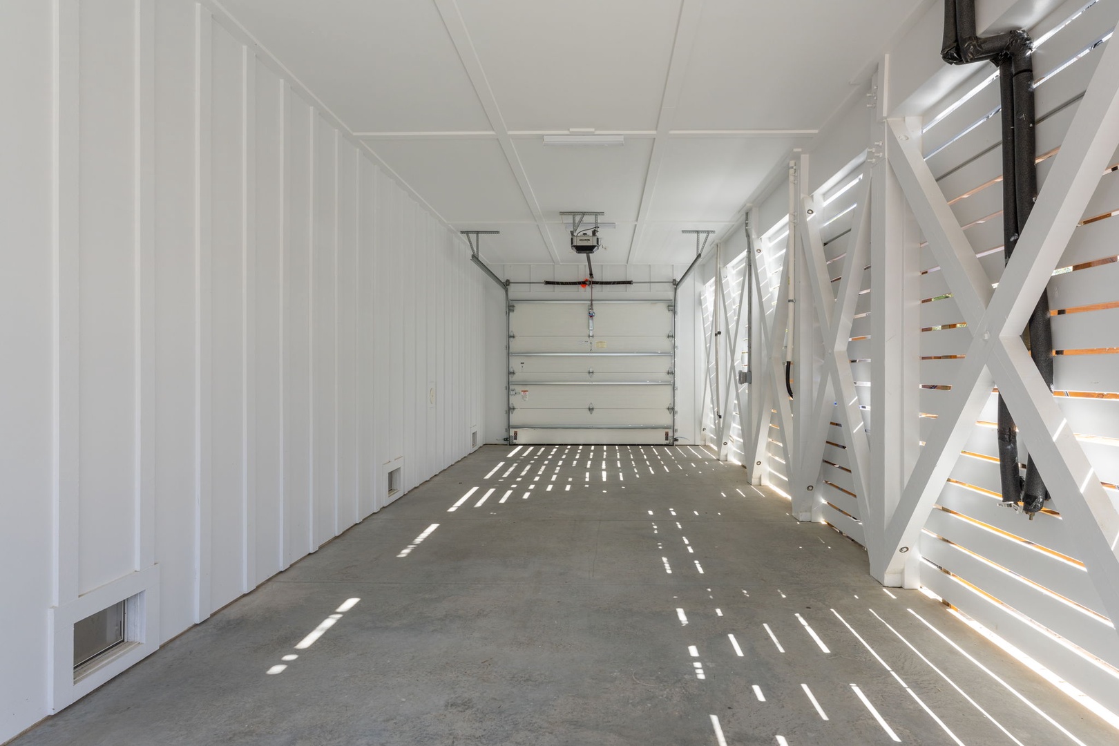 Spacious garage with your own staircase access, perfect for storing vehicles and gear during your stay.