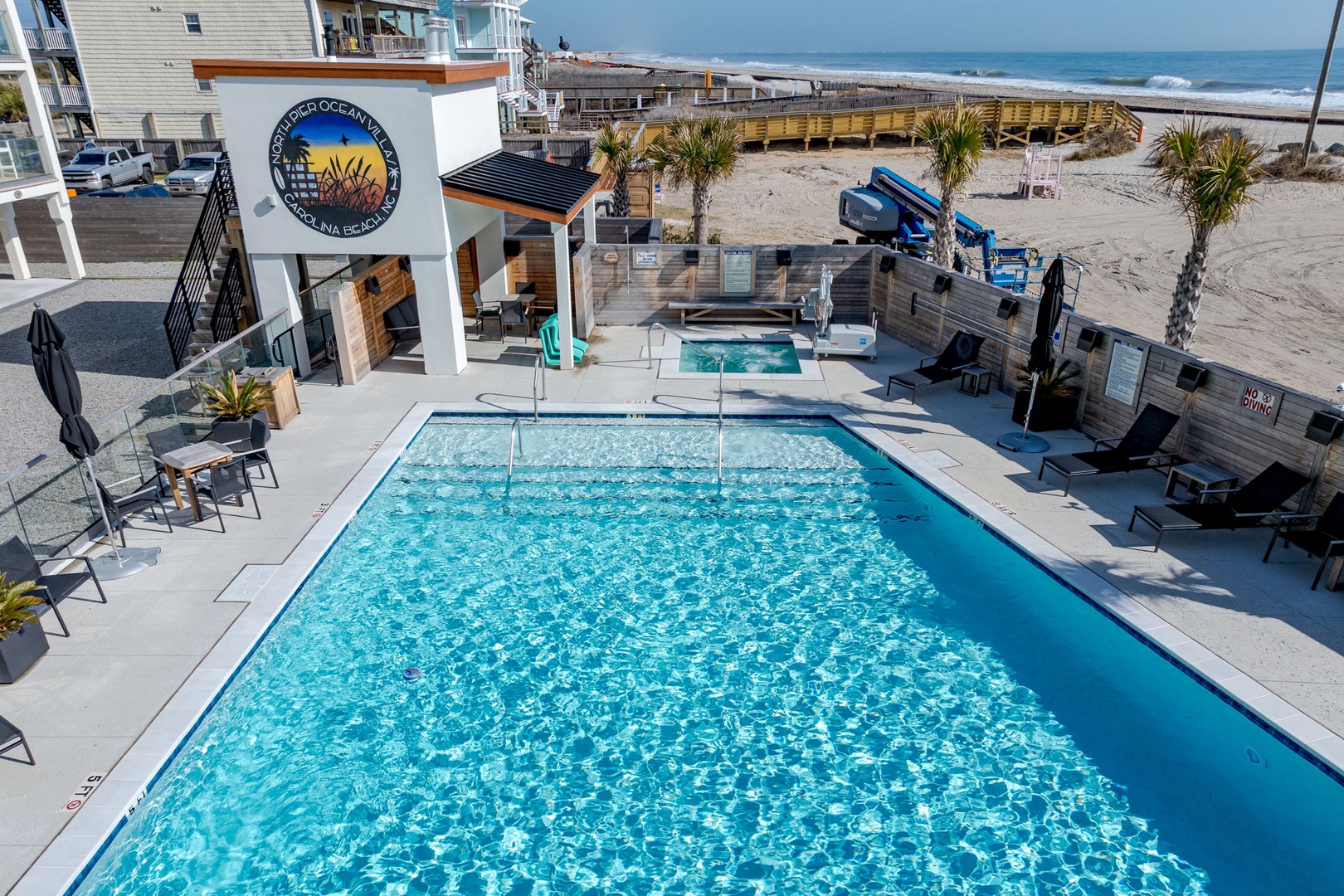Dive into crystal-clear waters at your beachfront retreat, with sparkling pool and hot tub just steps from the sand.