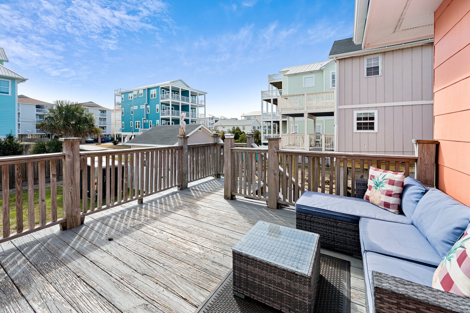 Coastal beach community with colorful oceanfront homes and vacation rentals visible in the surrounding neighborhood area.