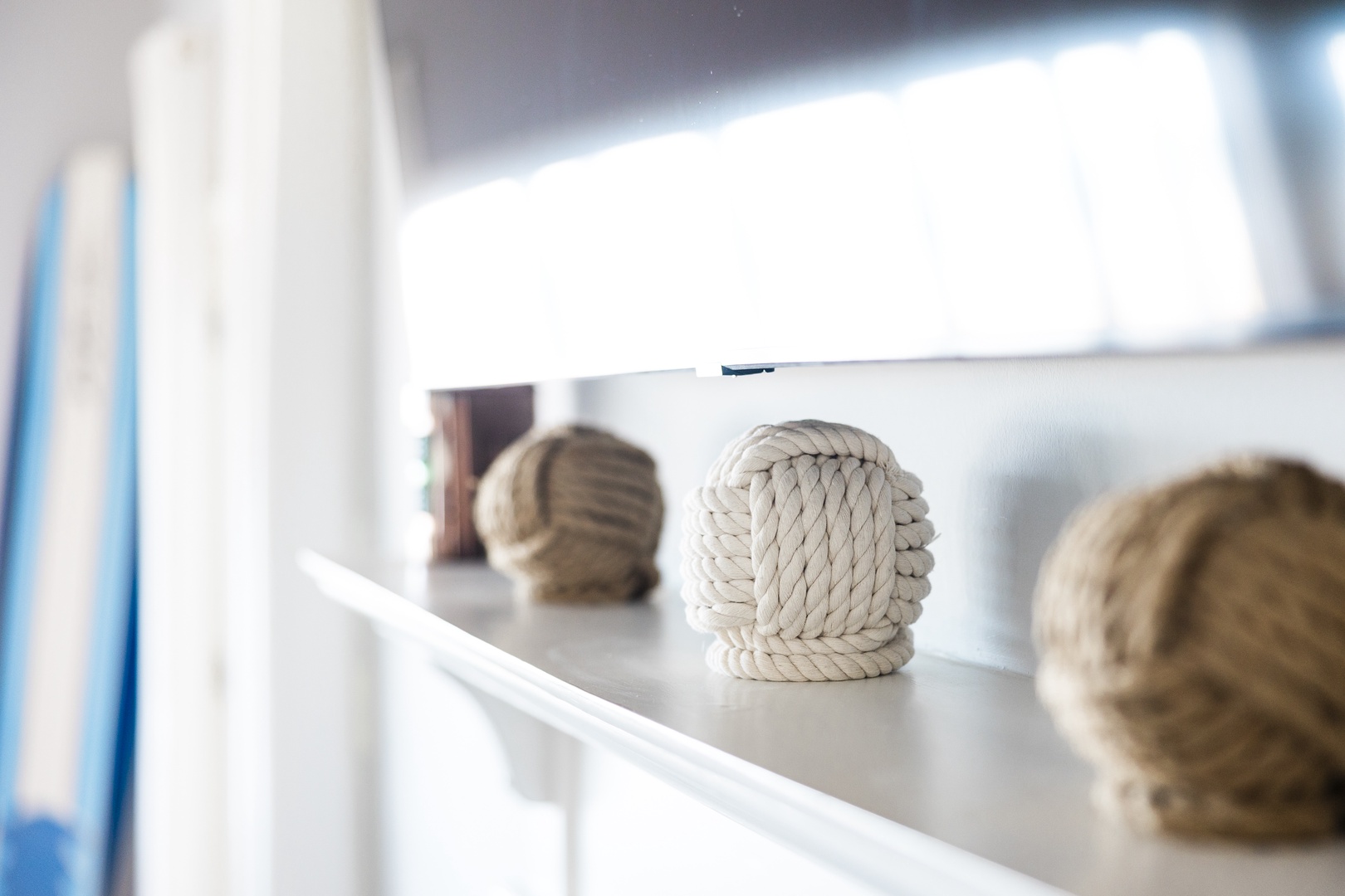 Thoughtful nautical touches add coastal charm to your shelf space, creating a serene seaside atmosphere throughout your stay.