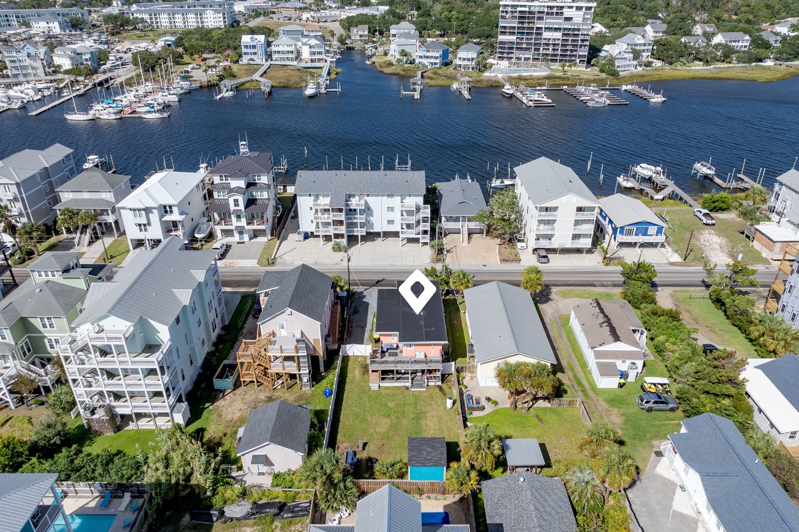 Waterfront coastal community with marina access and modern beach homes in a scenic residential neighborhood.