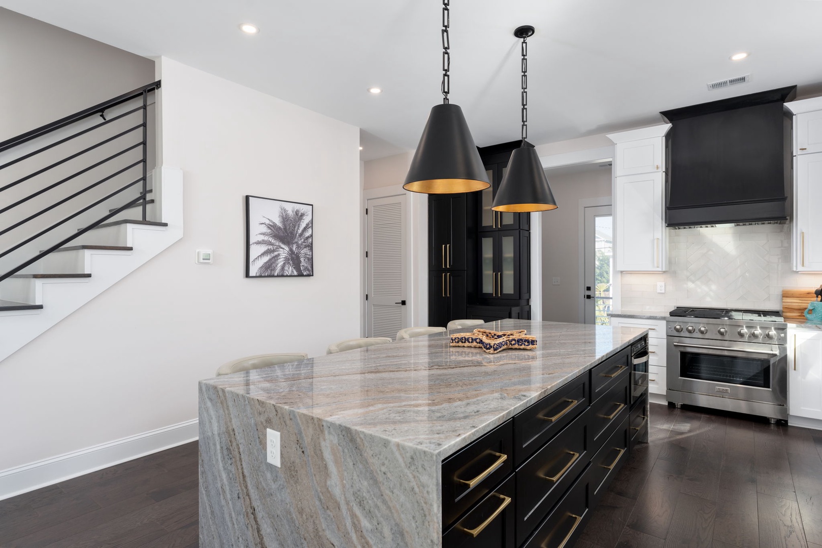 Cook memorable meals in your stunning modern kitchen with marble island, professional appliances, and elegant lighting.