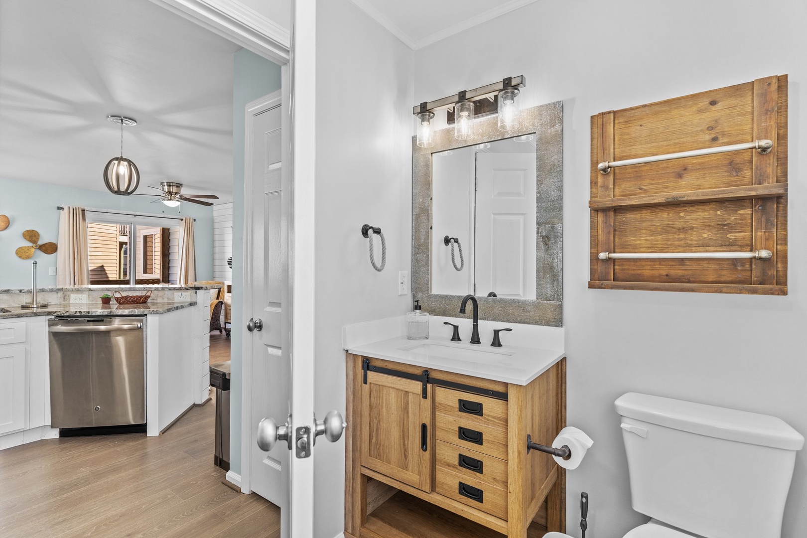 Your stylish bathroom features rustic wood vanity, modern fixtures, and thoughtful design touches that create a perfect blend of comfort and elegance.