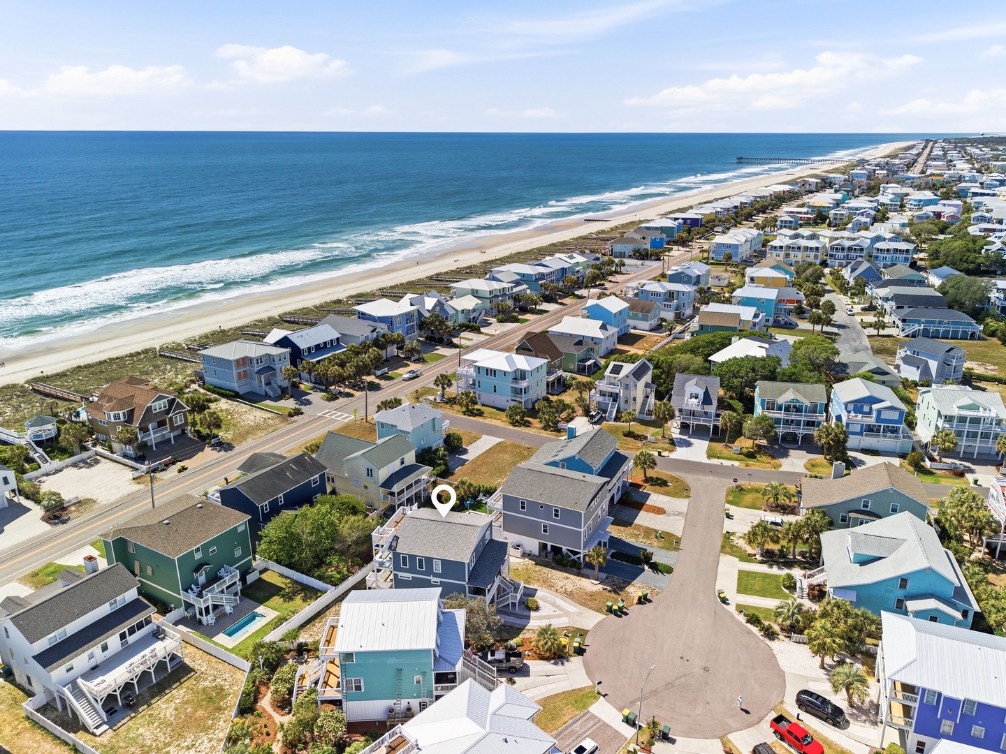 Coastal vacation rental neighborhood near pristine beaches, offering easy access to oceanfront living and beachside activities within a charming seaside community.
