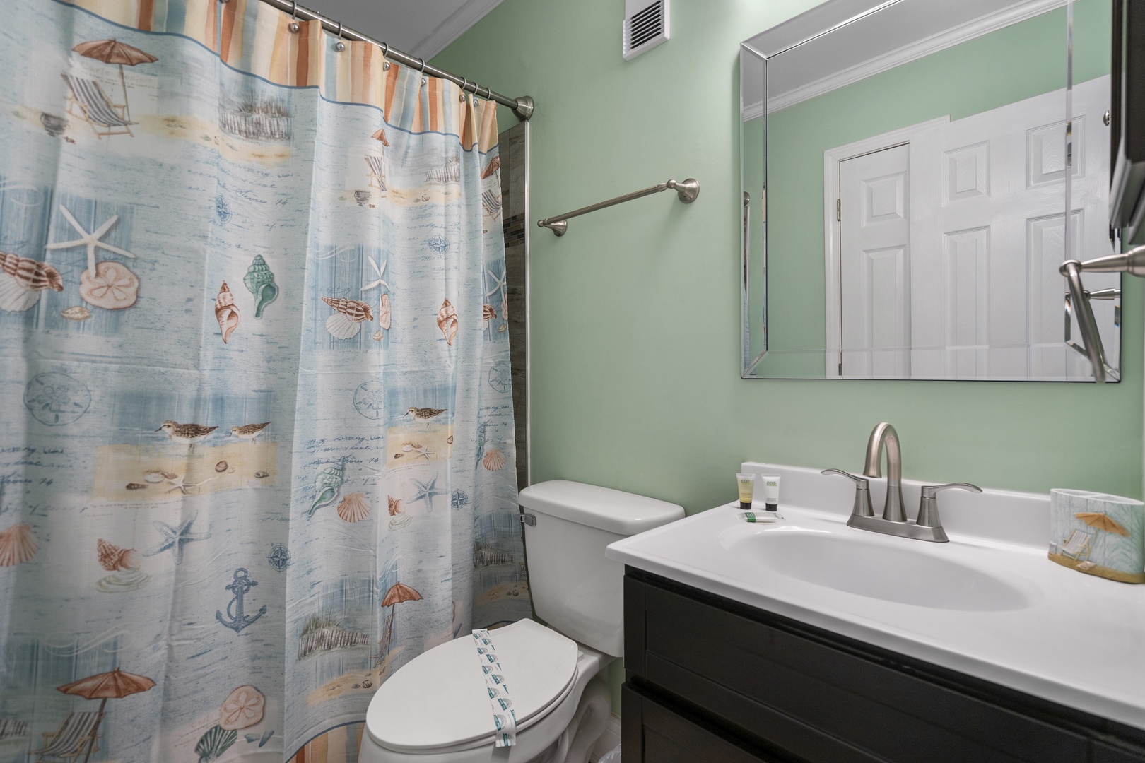 Step into your coastal-themed bathroom where sea-inspired décor meets modern comfort, creating your perfect seaside retreat.