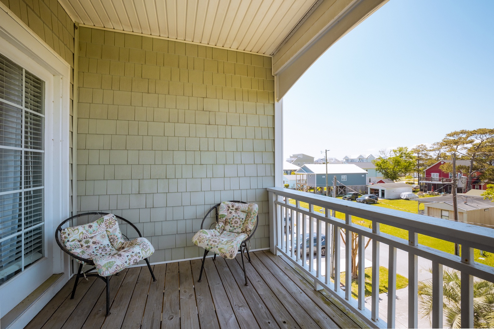 Start your morning with coffee on your private balcony, watching the neighborhood come alive below.