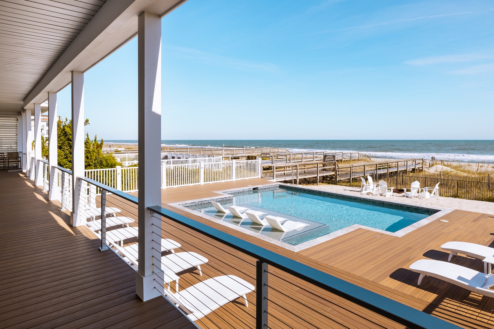 Step onto your private deck and soak in breathtaking oceanfront views. Dive into your pool then unwind on loungers with endless sea stretches ahead.
