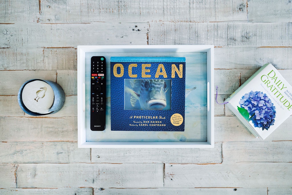 Unwind with your favorite shows on the smart TV, complete with streaming access and thoughtful touches like books and candles nearby.