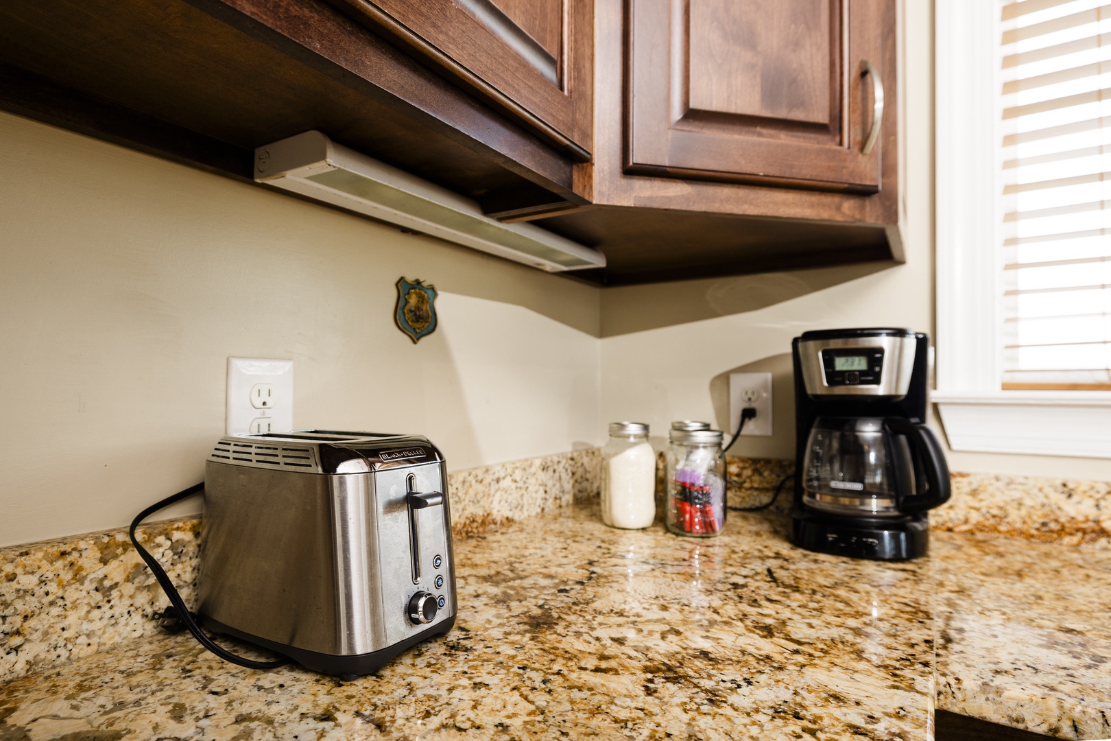 Start your mornings right with fresh coffee and toast in your well-appointed kitchen featuring granite counters and quality appliances.