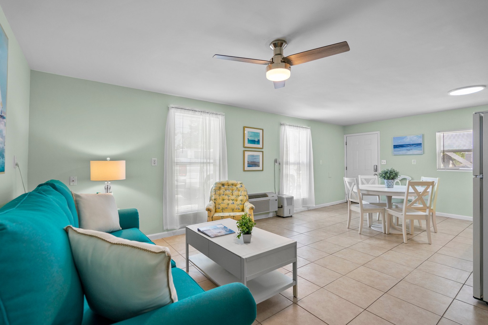 Relax in your bright, airy living space with soothing coastal colors, comfortable seating, and an open layout perfect for unwinding after beach adventures.