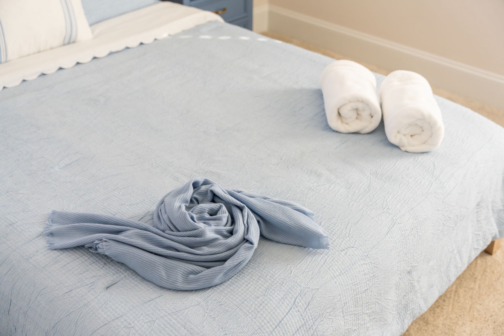 Sink into soft linens and fresh towels waiting on your comfortable bed—your perfect retreat after exploring.