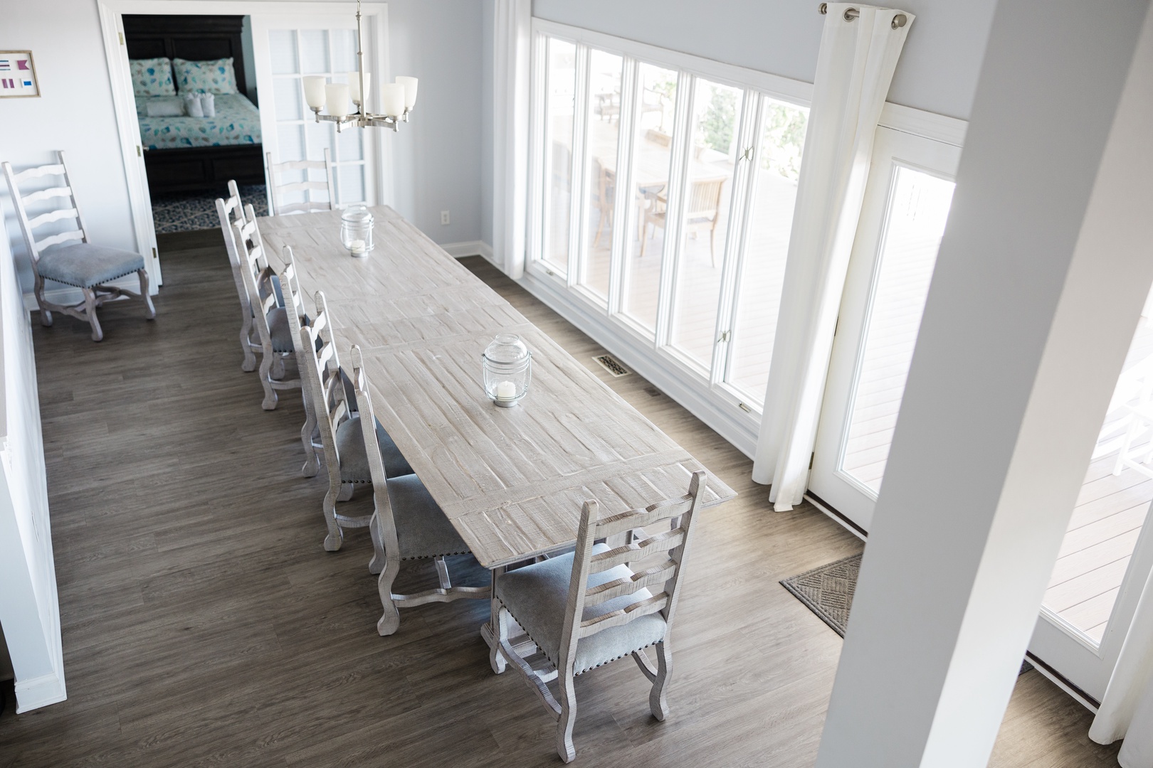 Gather around this spacious dining table where your group can share meals and create memories together in this bright, welcoming space.