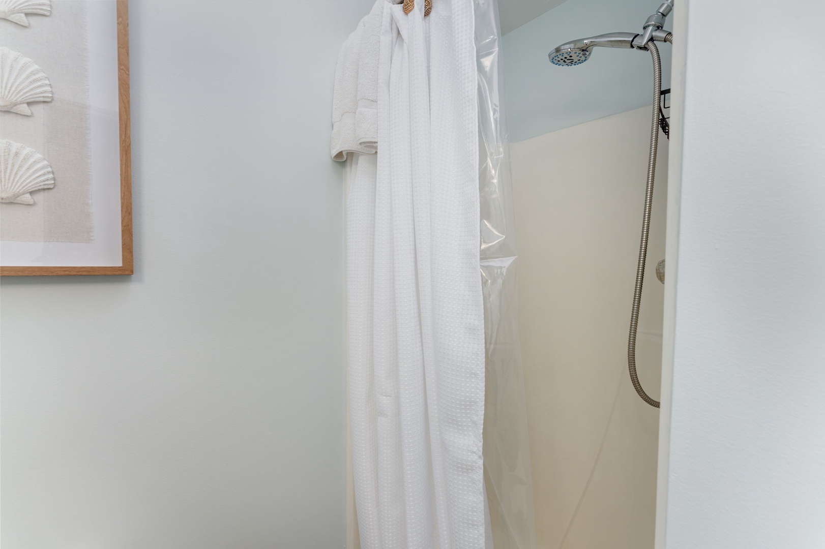 Refresh after a day of exploring in your private shower with crisp white towels and a rainfall showerhead ready for you.