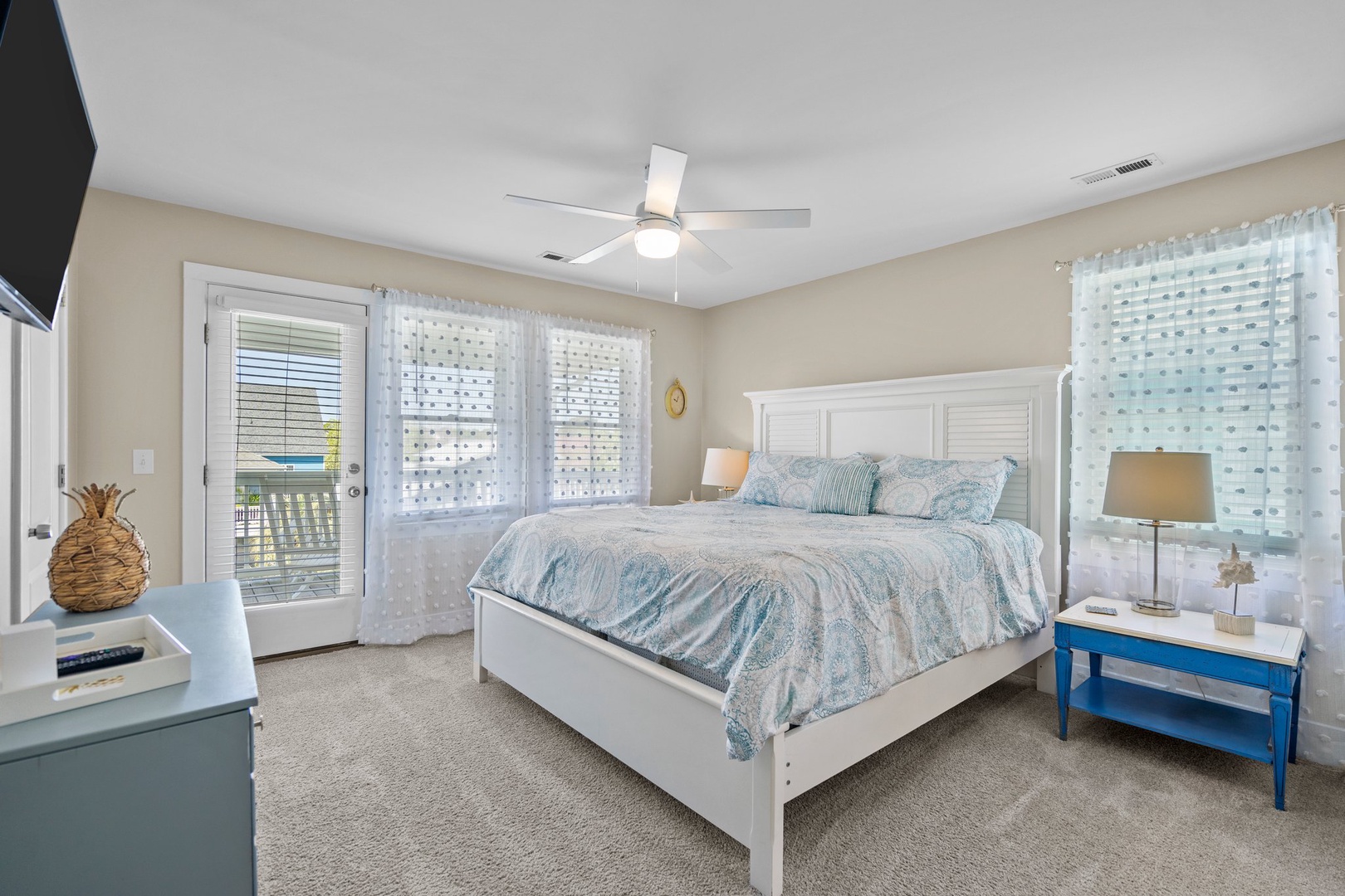 Drift off in this serene coastal bedroom where ocean-inspired blues and soft whites create your perfect seaside retreat.