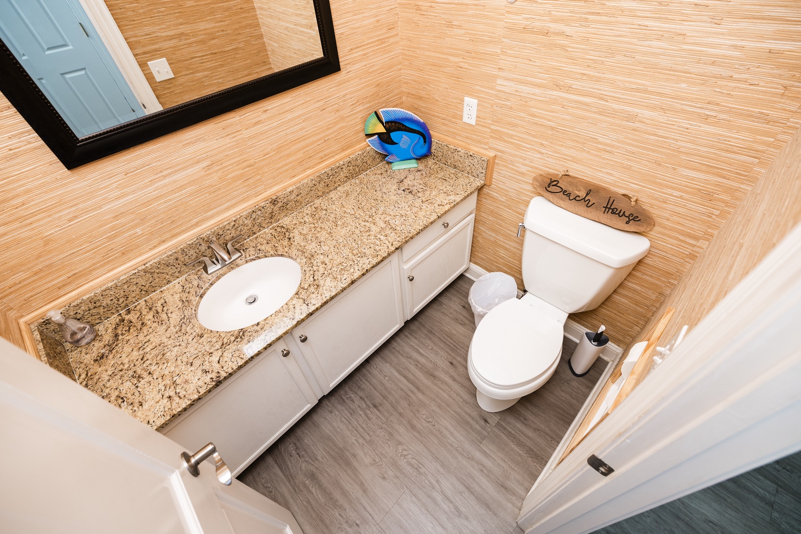 Your private bathroom features granite counters, ample storage, and beach-themed touches that'll make you smile.