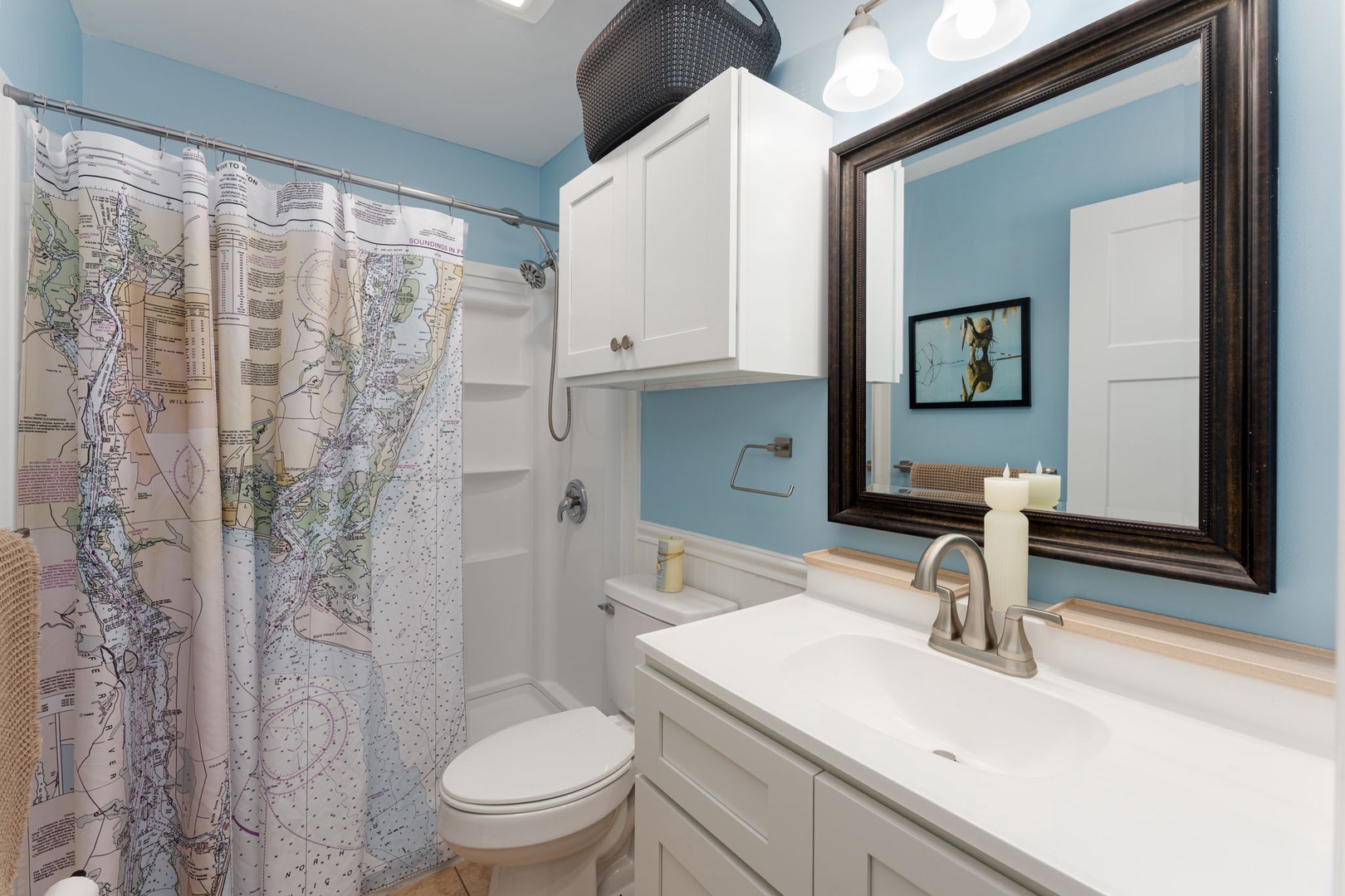 Refresh in your nautical-themed bathroom with charming map shower curtain and coastal touches.