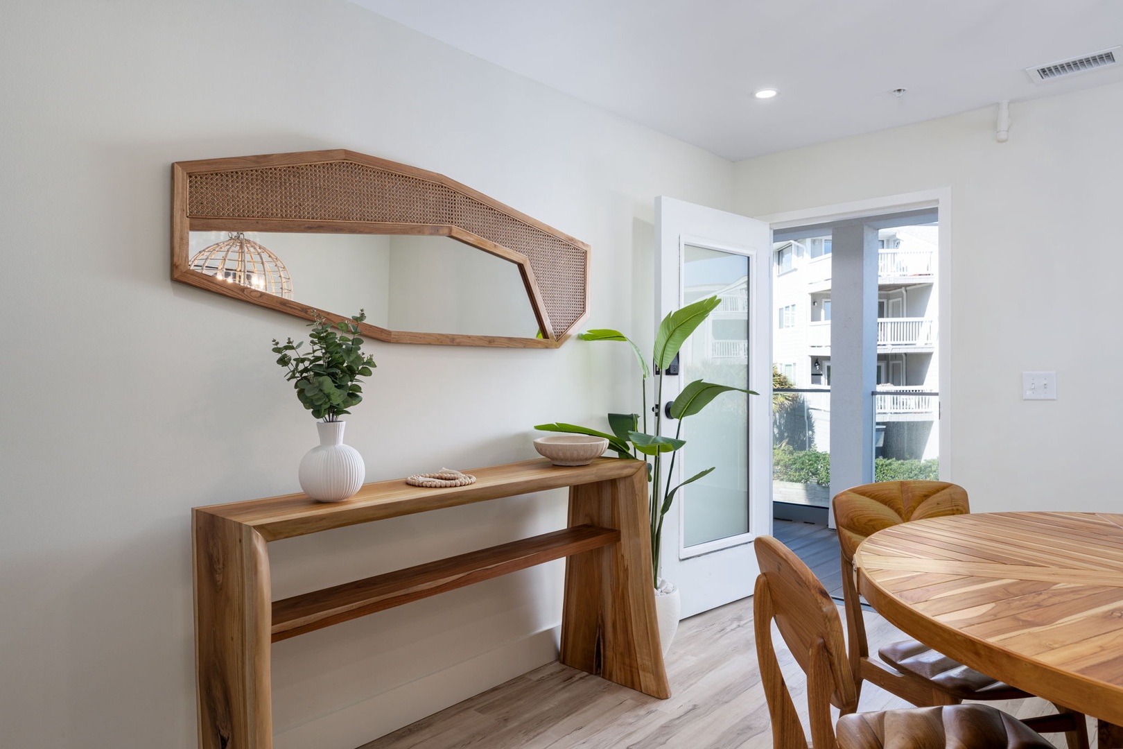 Your bright dining space blends warm wood tones with modern comfort, creating the perfect spot for meals and conversations.
