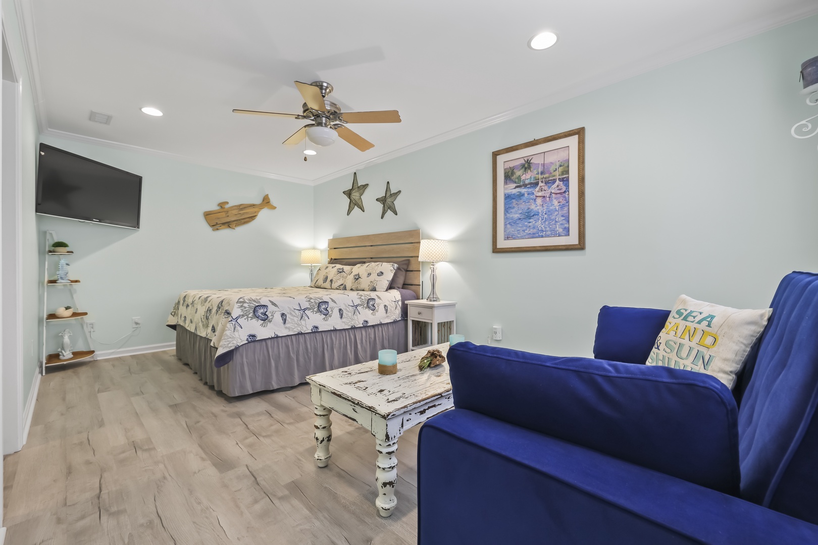 Sink into the plush bed after a day at the beach, or unwind on the cozy sofa while the ceiling fan keeps you cool. Coastal charm meets comfort in your restful retreat.