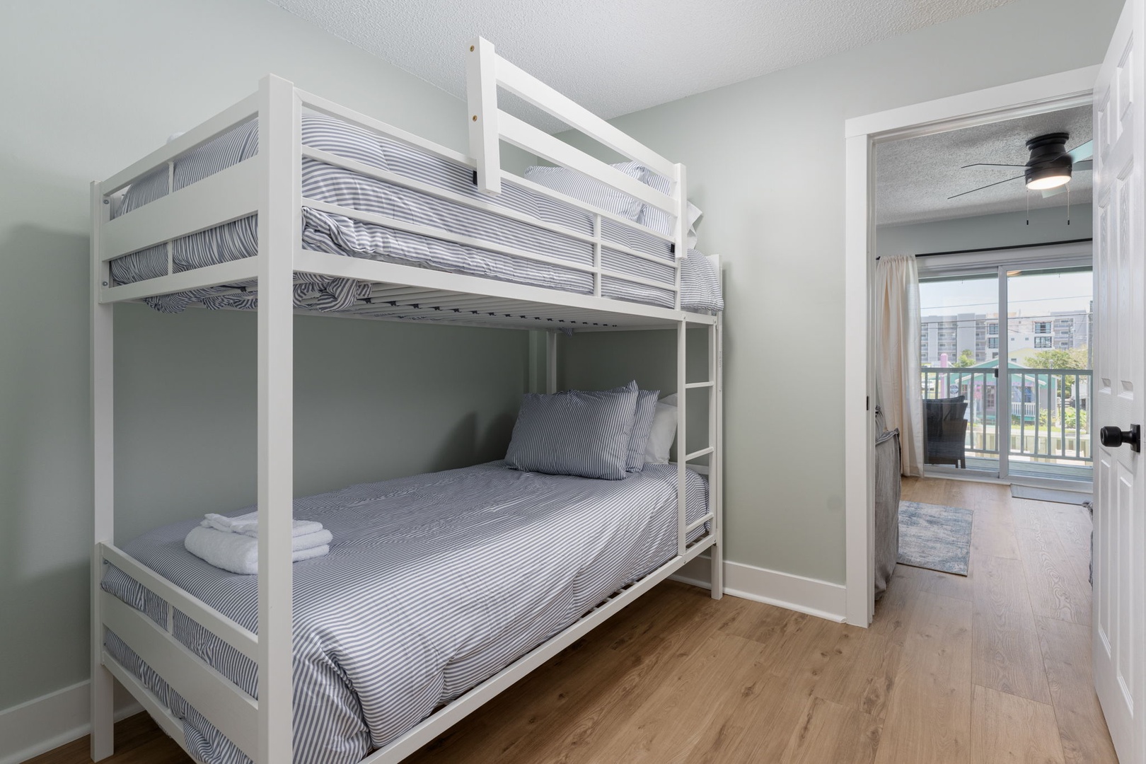 Your kids will love this bright bunk room with crisp linens and calming neutral tones, perfect for restful nights after fun-filled days exploring.