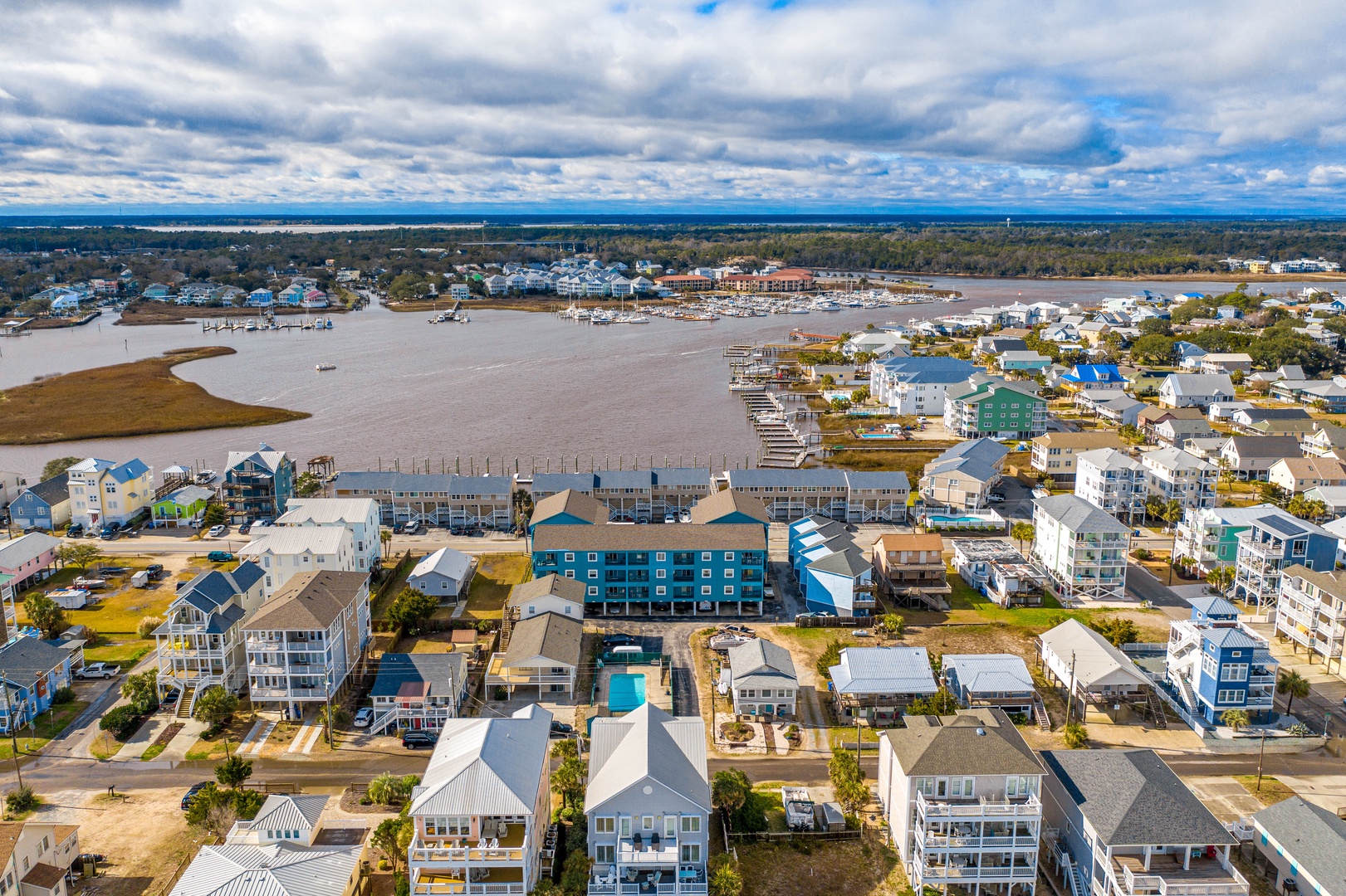 Charming coastal community with waterfront homes, marina access, and peaceful bay waters creating the perfect seaside retreat setting.