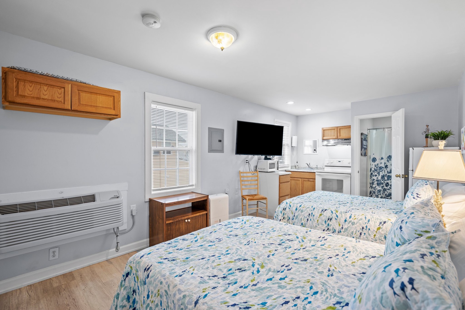 Your cozy suite blends comfort and convenience with twin beds, kitchenette, and modern amenities for a relaxing coastal stay.