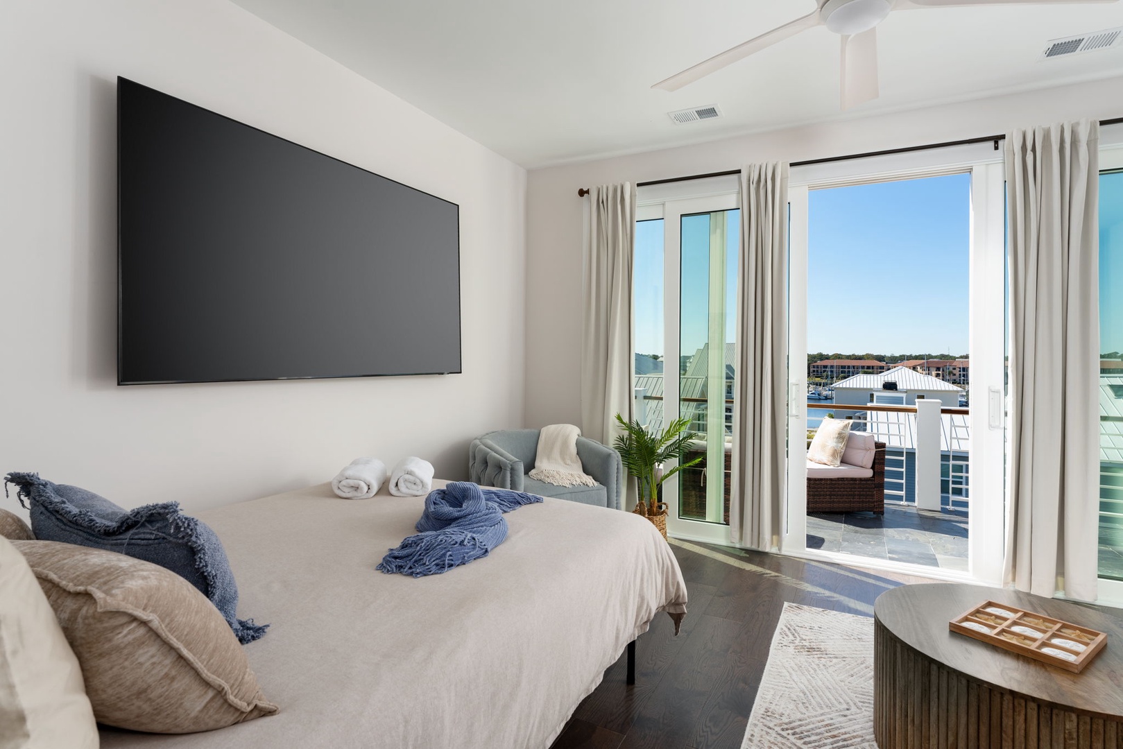 Wake up to crisp white linens and stunning views through your floor-to-ceiling windows. Step onto your private balcony for morning coffee.