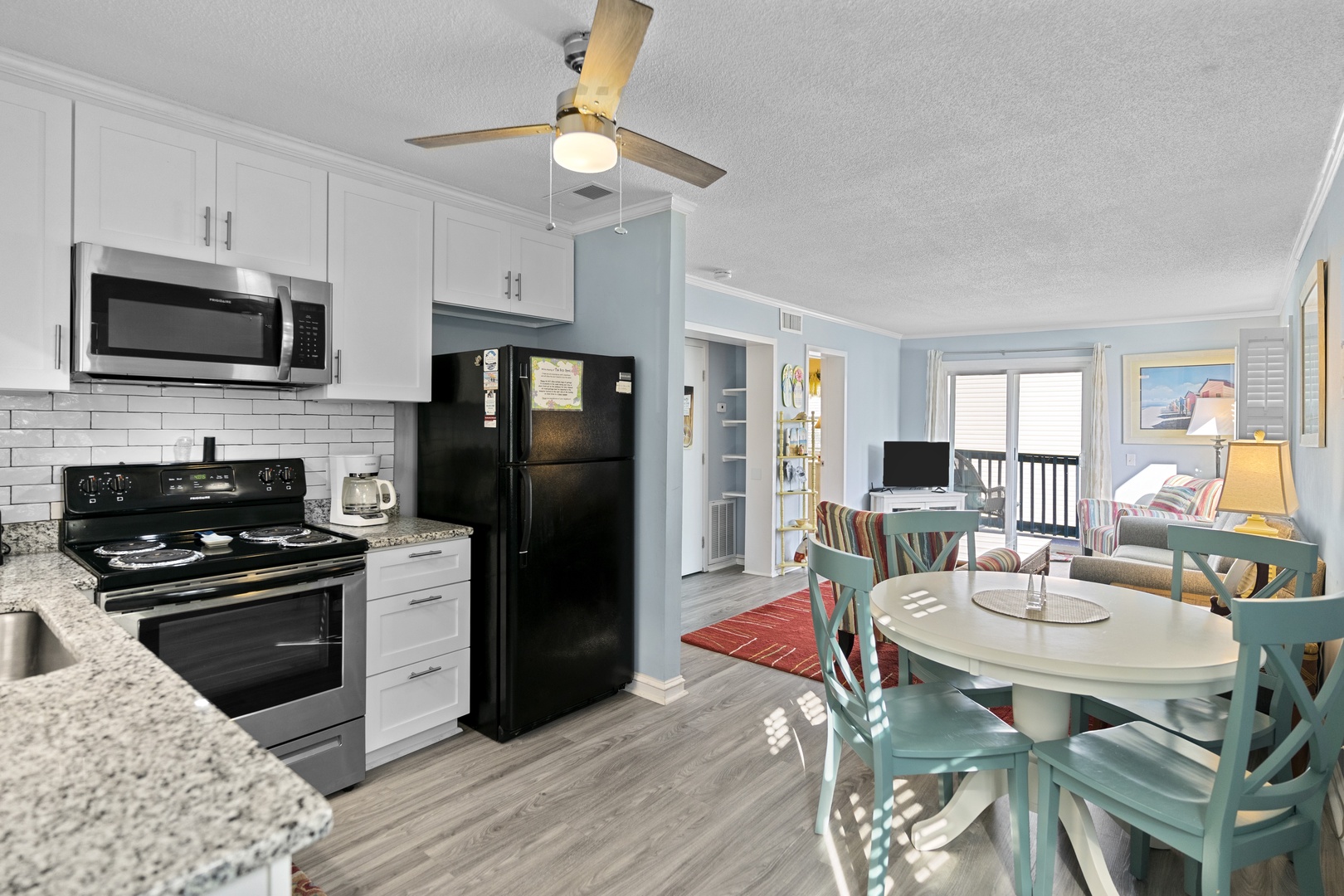 Your bright, open-plan space combines modern kitchen convenience with coastal charm—perfect for preparing meals while staying connected to your group.