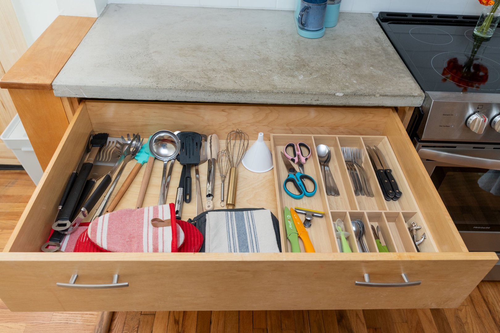 You'll find everything perfectly organized in spacious kitchen drawers with quality utensils and tools ready for your culinary adventures.