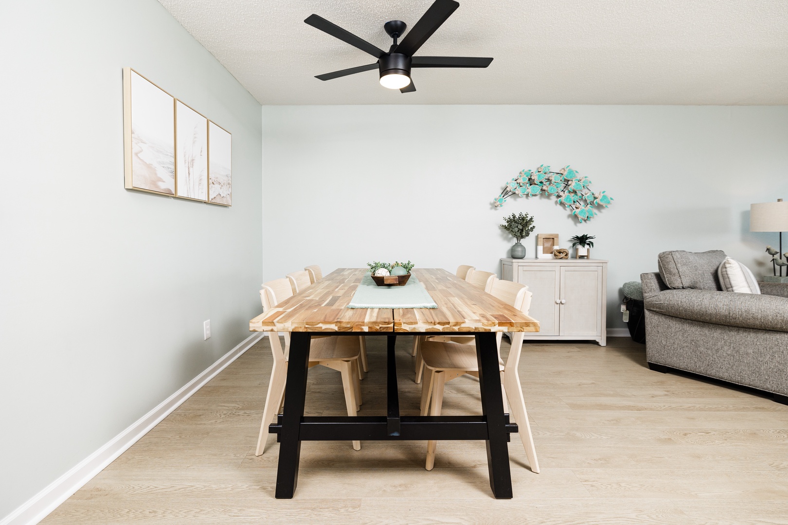 Gather around your elegant dining table for memorable meals in this stylish, light-filled space with modern coastal decor.