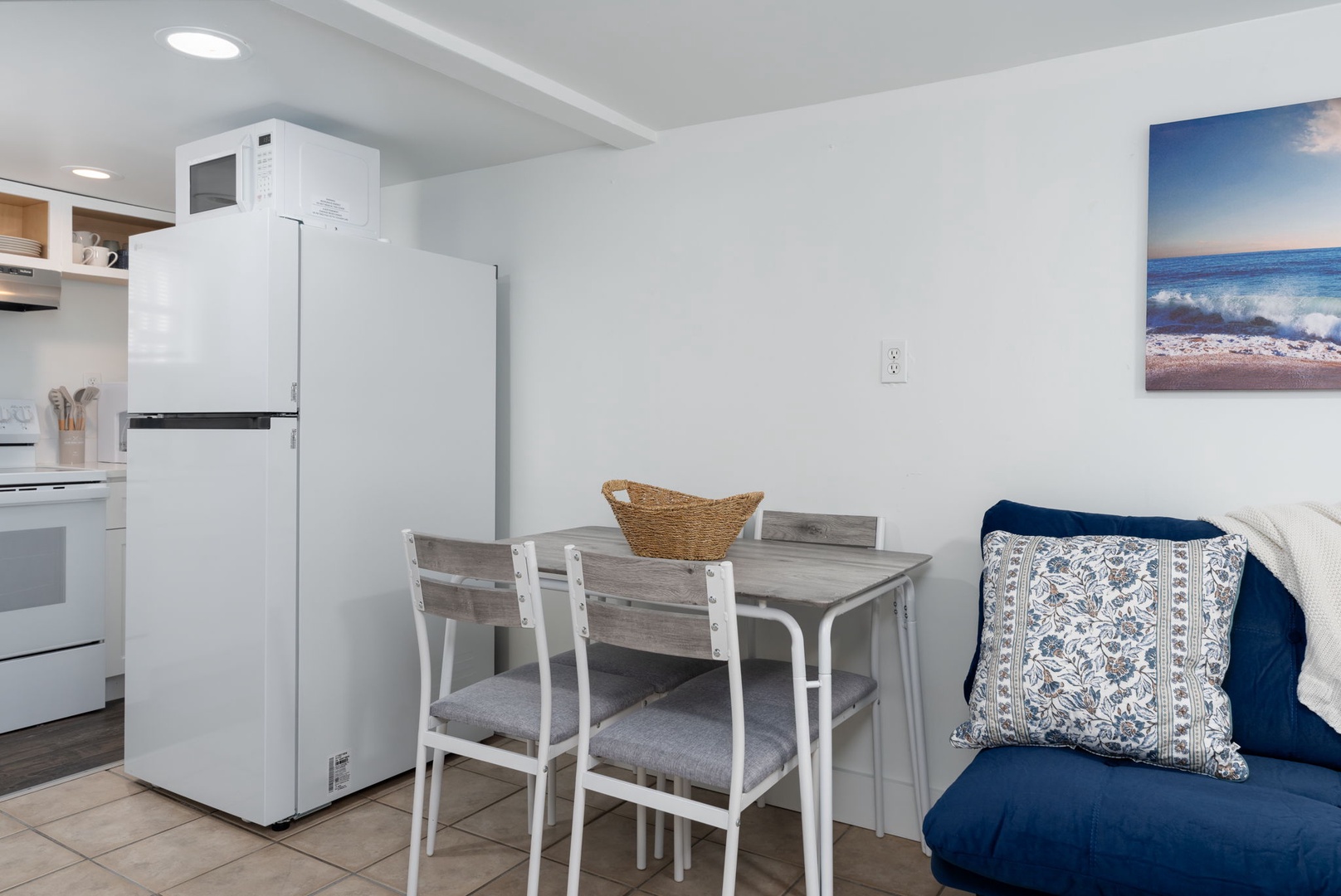 Your cozy dining nook awaits with ocean-inspired touches, perfect for morning coffee or sharing meals together.