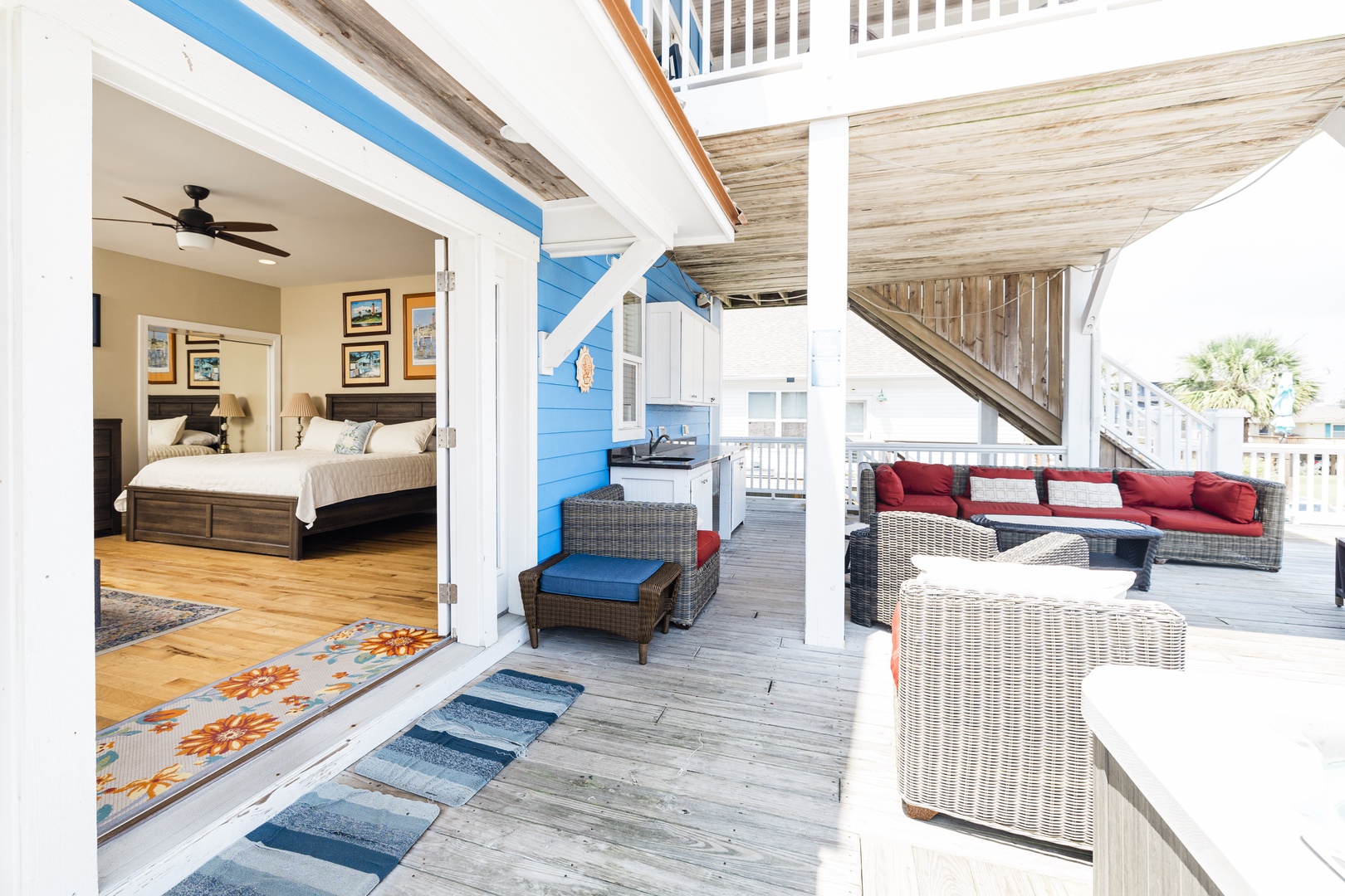 Unwind on your private deck with wicker seating and views, steps from your cozy bedroom retreat.