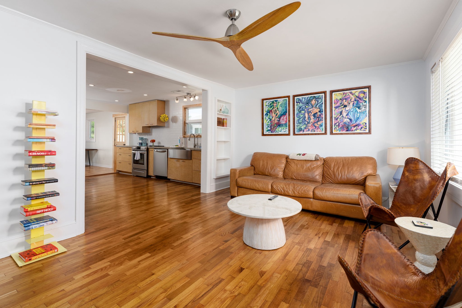 Settle into rich leather seating while warm wood floors and vibrant art create your perfect retreat sanctuary.