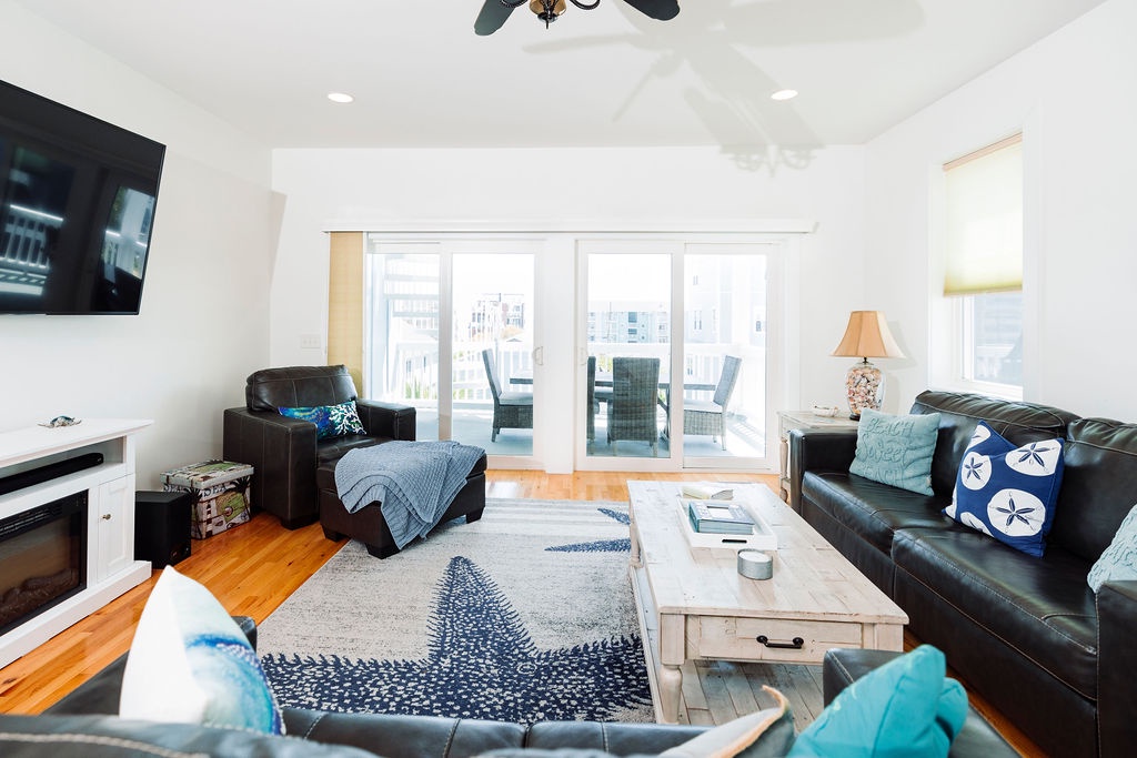 Relax in this bright living space with leather seating, hardwood floors, and sliding doors to your private balcony.