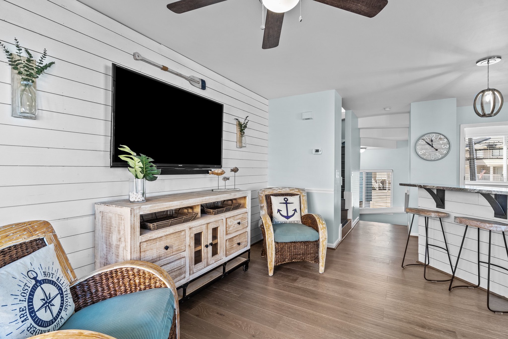 Unwind in your coastal-inspired living space with nautical touches, warm wood tones, and modern conveniences for the perfect beach getaway.