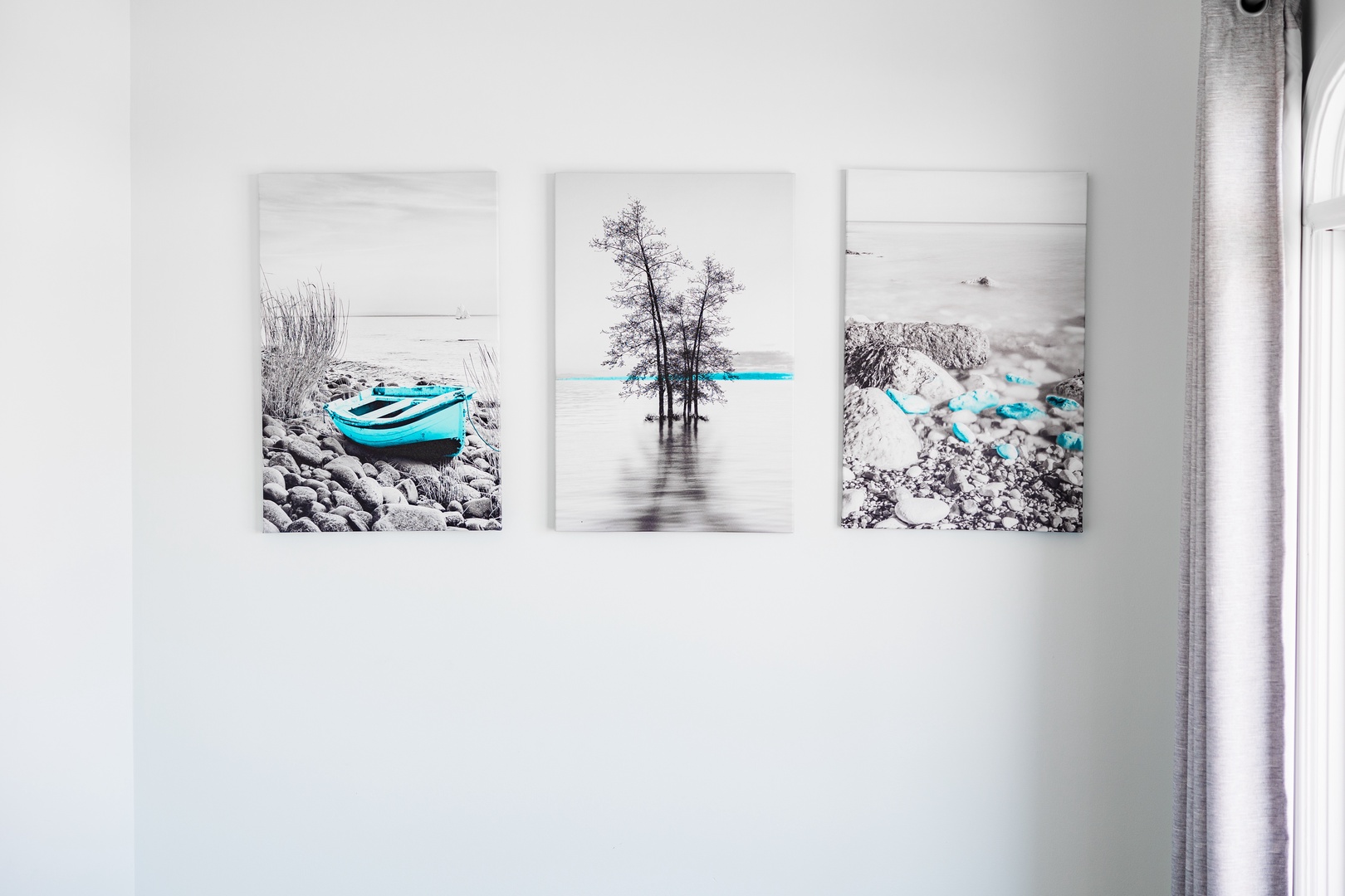 Stylish turquoise artwork adds a serene coastal touch to your bright, modern space, creating the perfect atmosphere for relaxation.