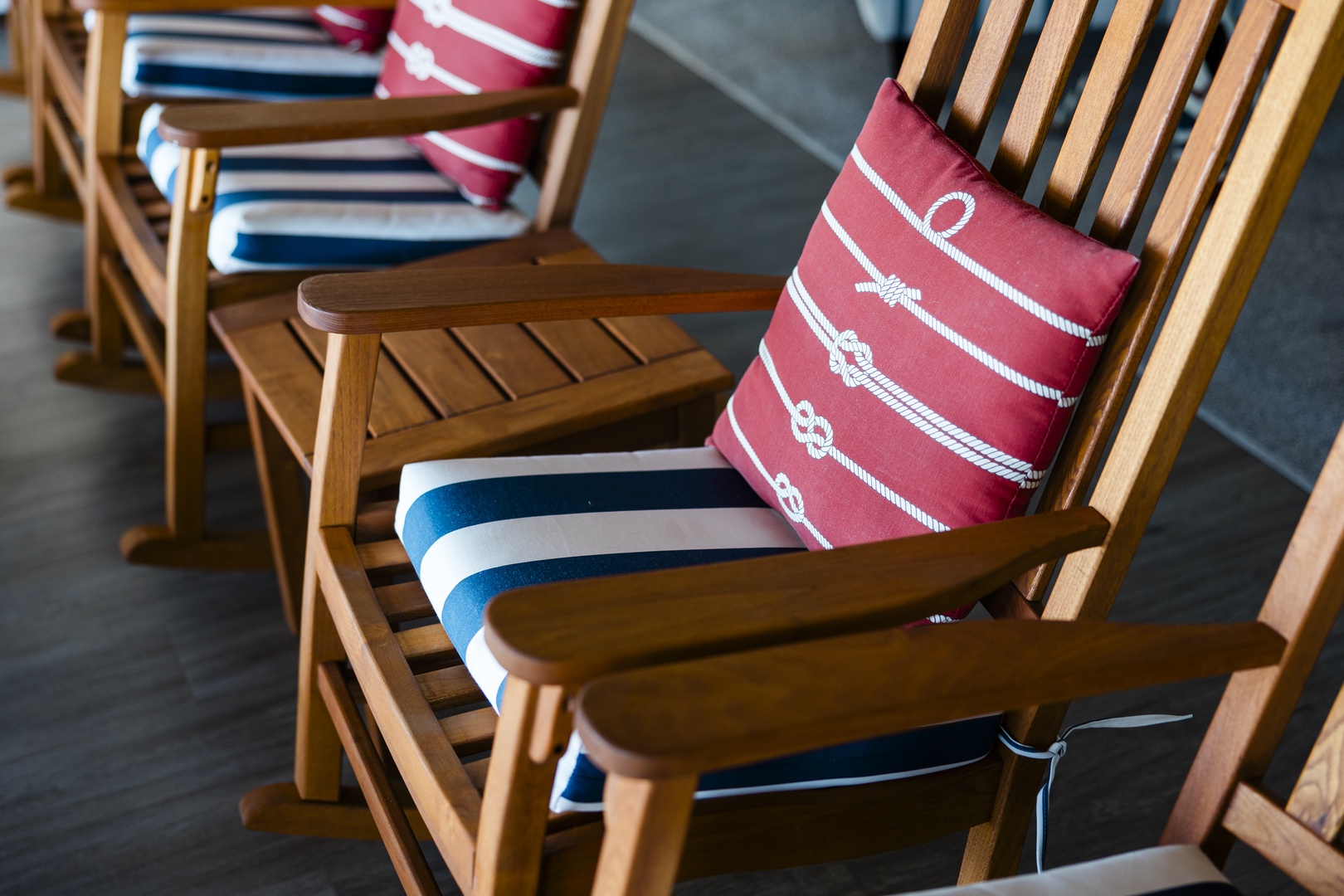 Settle into your comfortable wooden chairs with charming nautical cushions - perfect for enjoying morning coffee or evening conversations on the terrace.