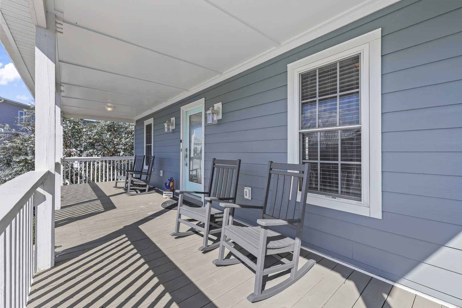 Picture yourself rocking gently in one of these classic chairs on your private front porch, sipping morning coffee as the breeze flows through. This welcoming covered space offers the perfect spot to unwind and watch the day unfold.