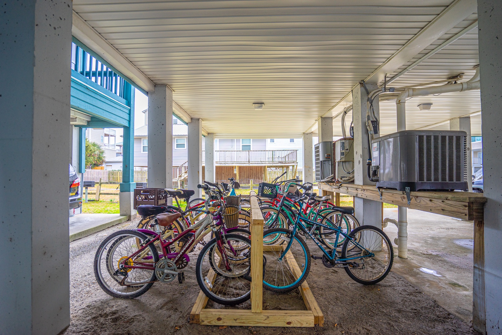 Your bikes await beneath the covered area, ready for coastal adventures and neighborhood exploration.