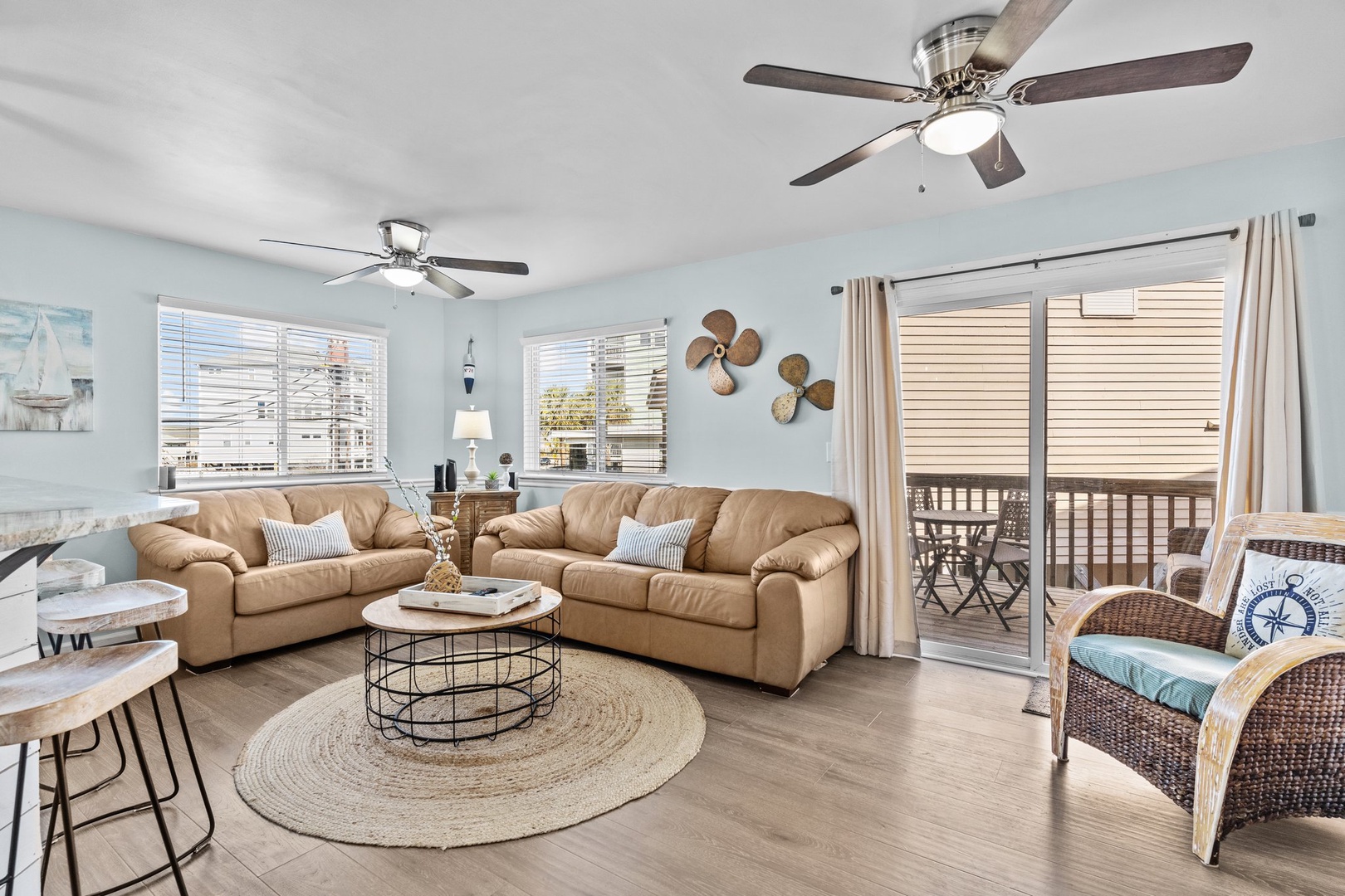 Unwind in this bright, coastal-inspired living room with plush seating and your own private balcony for morning coffee.