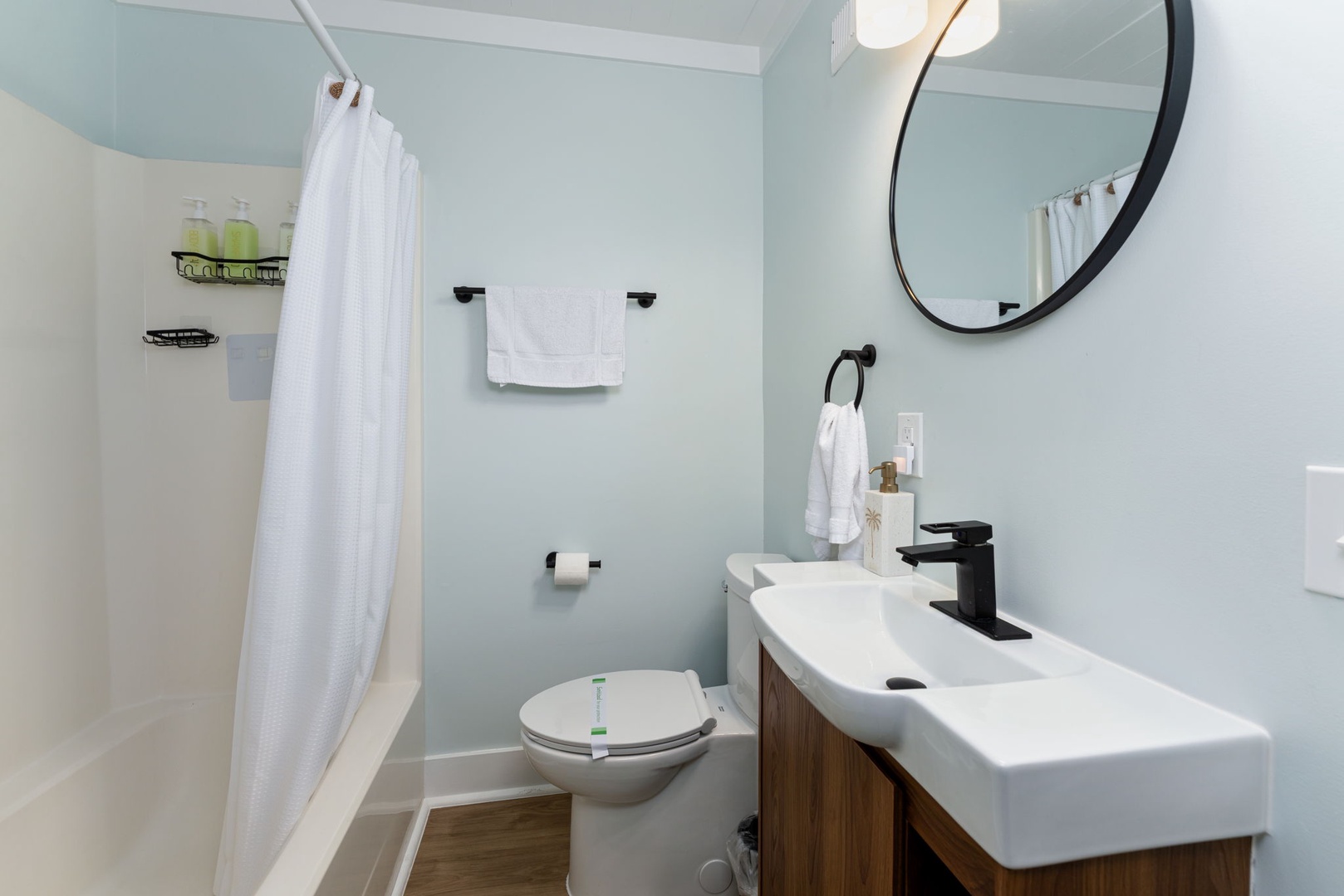 Freshen up in your private bathroom with modern fixtures, a spacious shower, and plush towels waiting for you after a day of adventure.