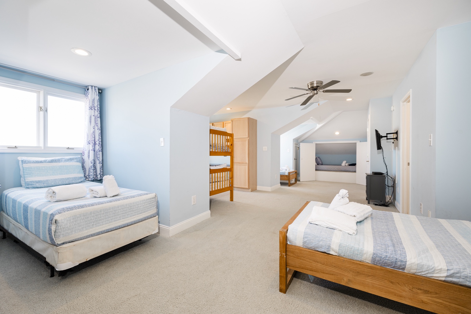 Your spacious upstairs bedroom offers comfortable sleeping arrangements with fresh linens and natural light streaming through ocean-view windows.