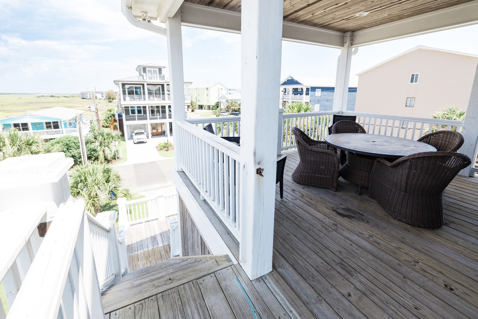 Relax on your private covered balcony with coastal views, perfect for morning coffee or evening dining.