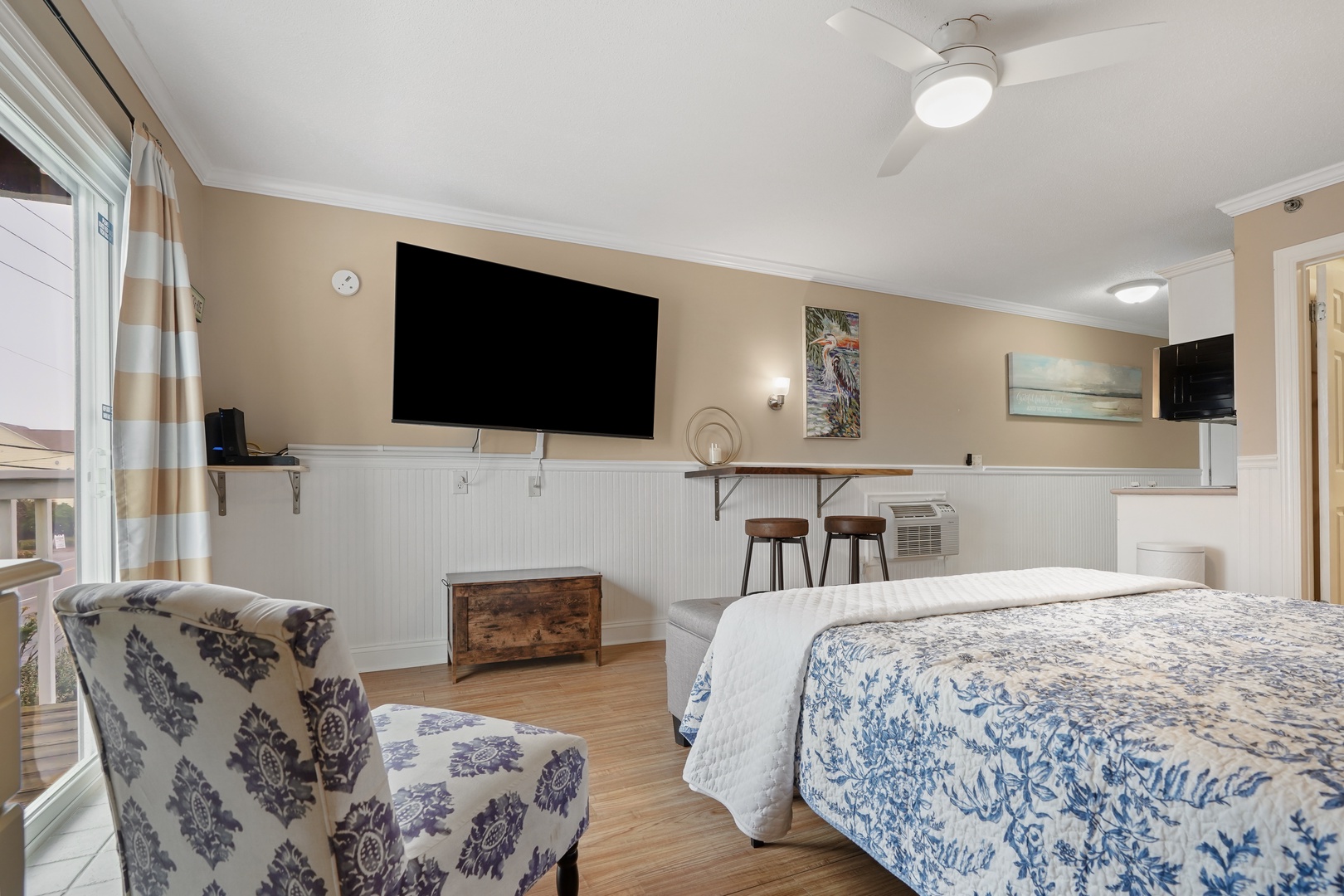Relax in your beautifully appointed room with cozy coastal charm, flat-screen TV, and comfortable seating perfect for unwinding after your adventures.
