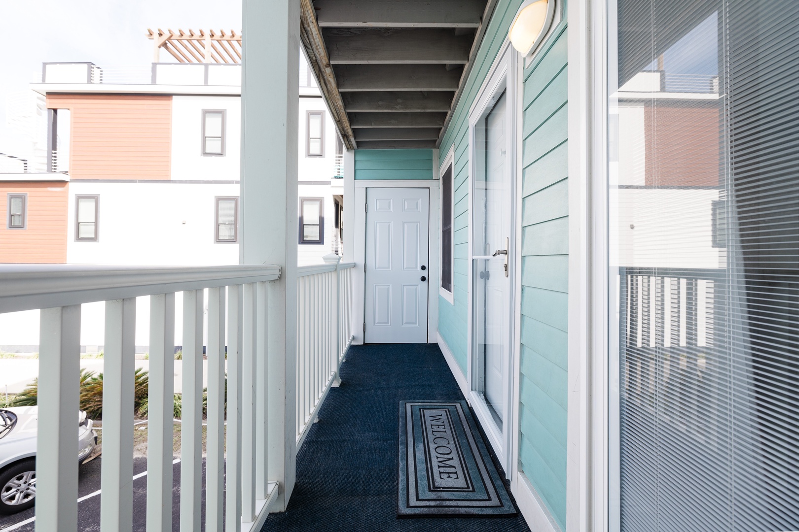 Step onto your private covered balcony with charming street views and a welcoming entrance that sets the tone for your coastal getaway.