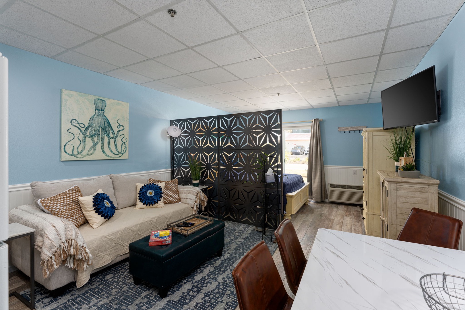 Your stylish studio combines comfort and function with a cozy living area, private sleeping nook, and modern dining space—perfect for relaxing after exploring.