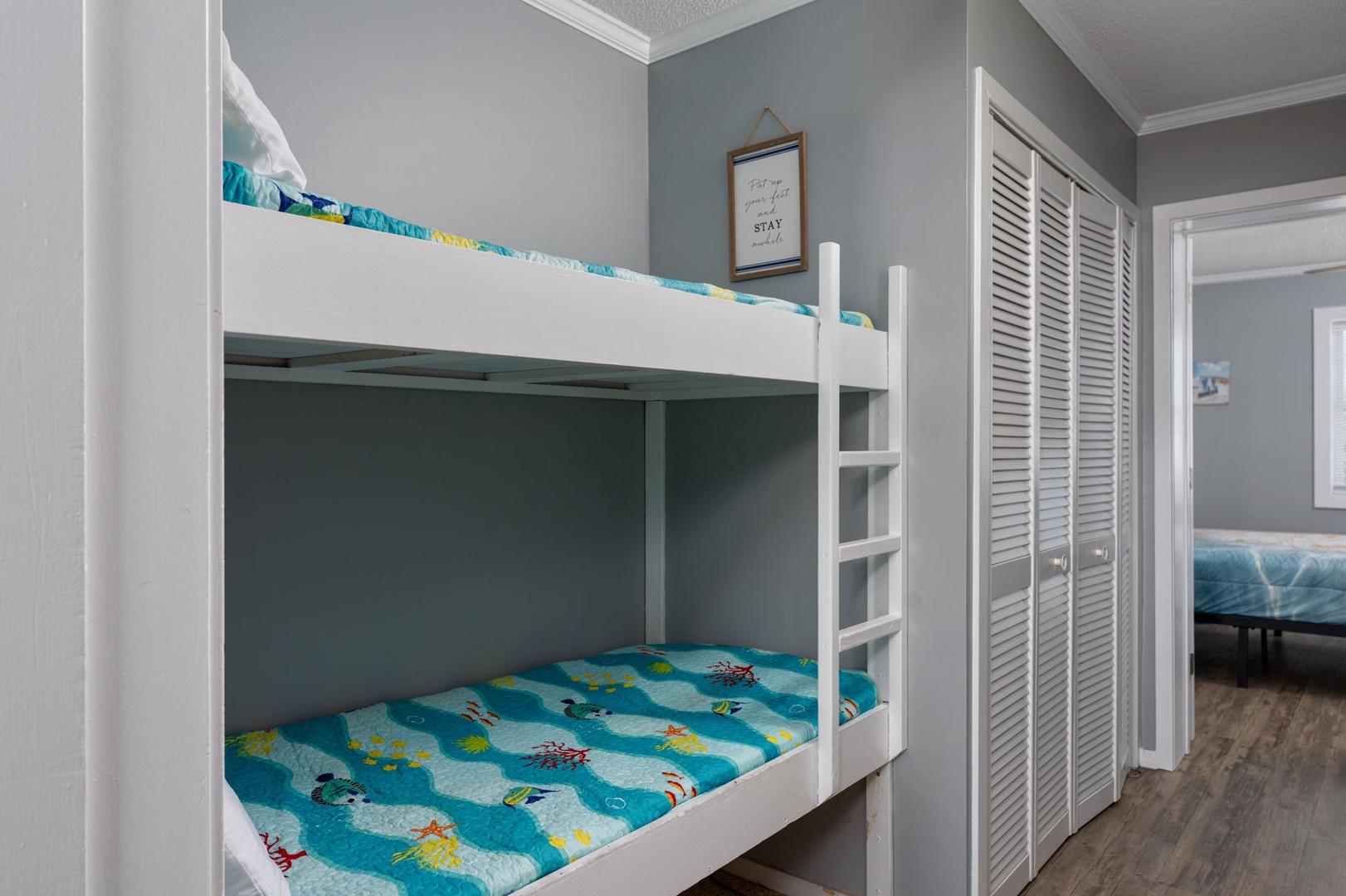Your kids will love climbing into their cozy bunk beds after a fun-filled day, surrounded by soothing coastal hues and cheerful bedding that inspire restful sleep.